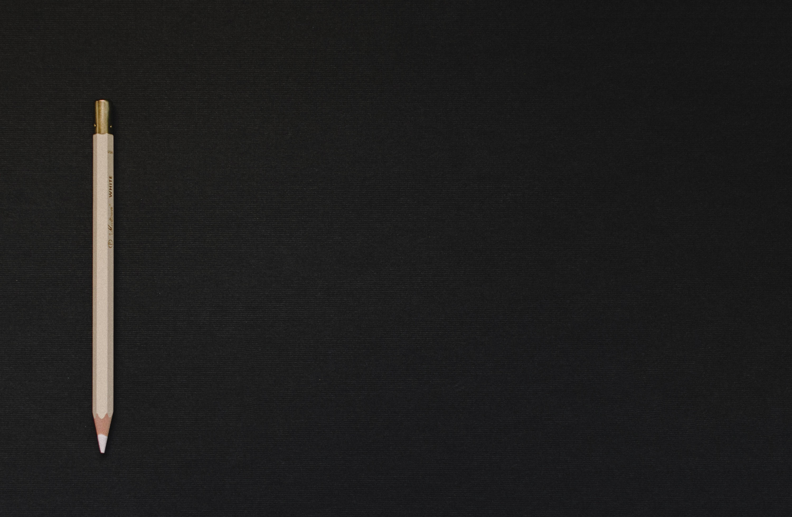 Black Page, white pencil, gold ferrule, 2K Desktop Wallpaper