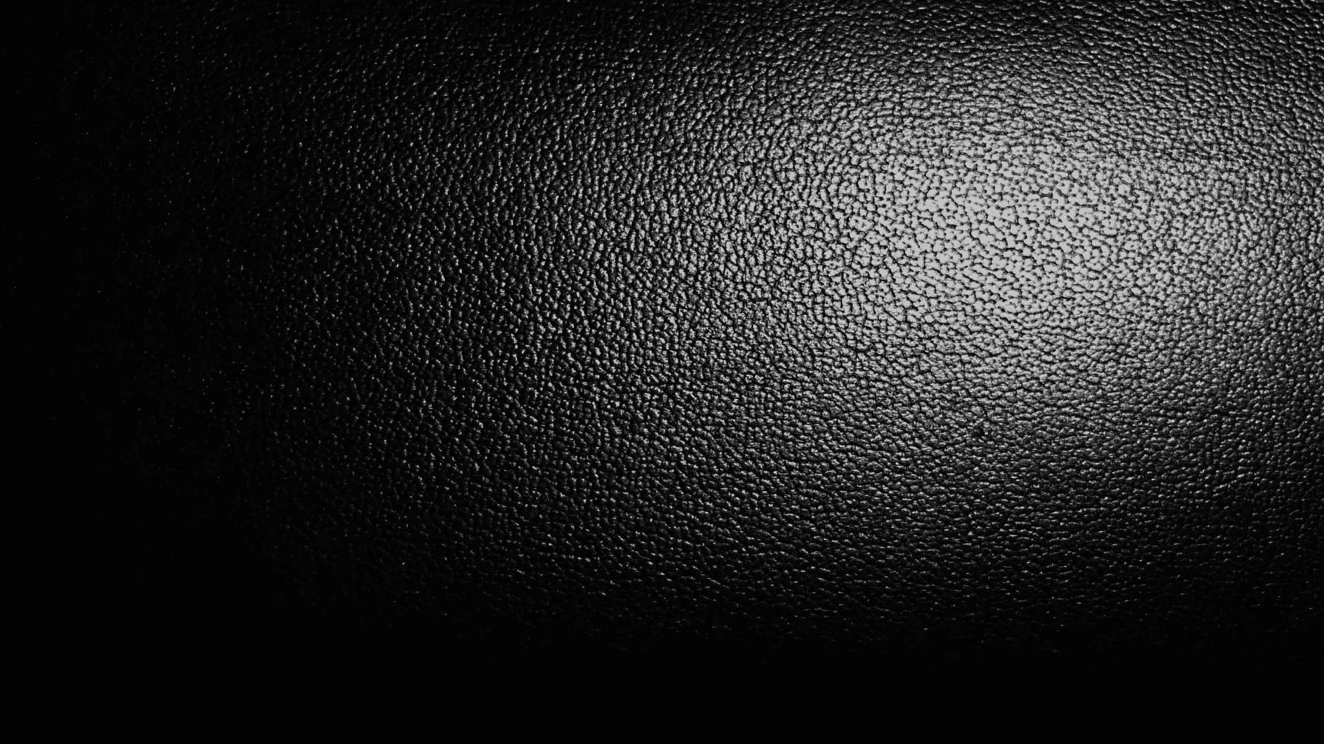 black pebbled leather, soft spotlight gradient, textured surface, Full HD Desktop Wallpaper
