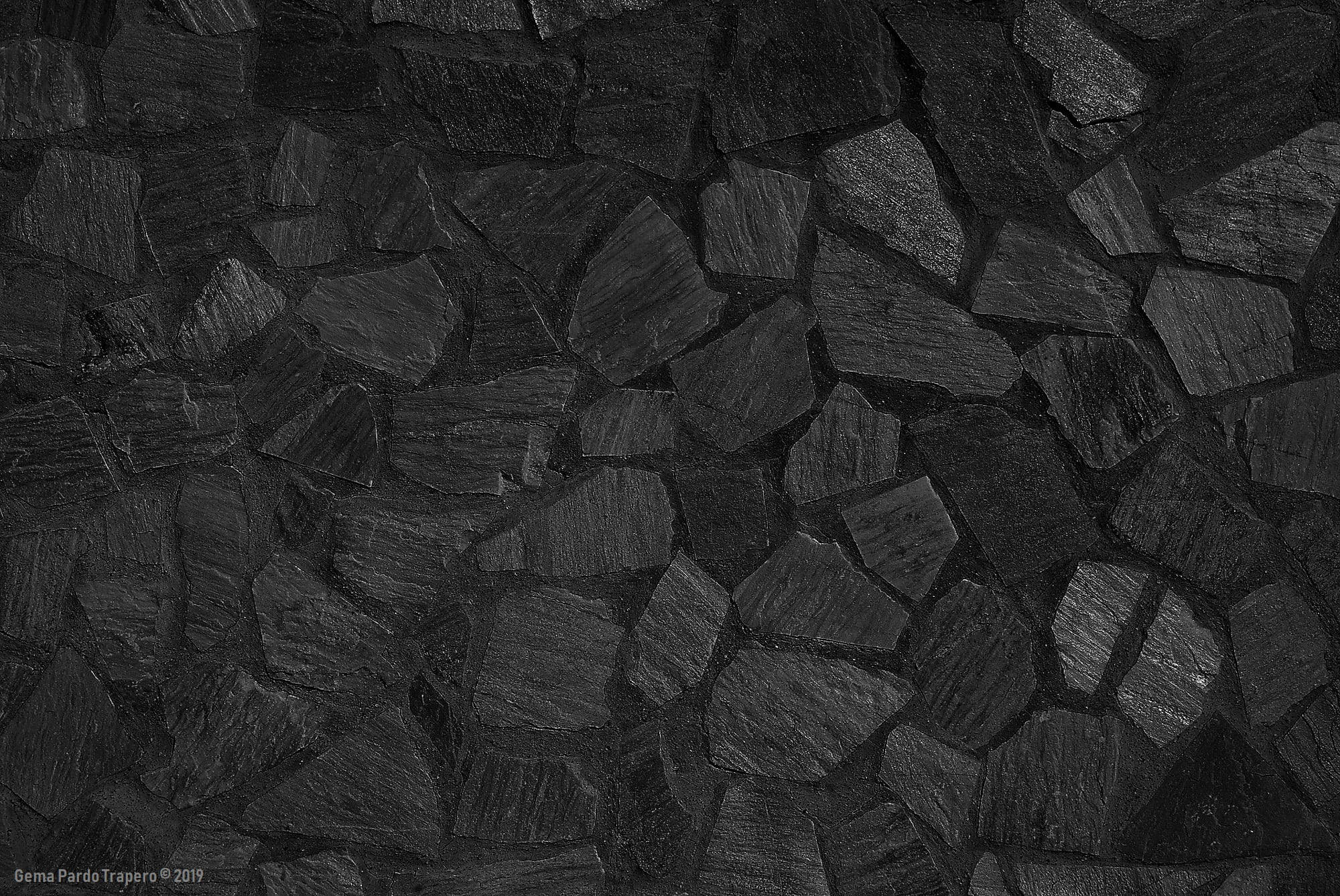 dark charcoal-black slate stones, rough textured surfaces, subtle gray highlights, Full HD Desktop Wallpaper