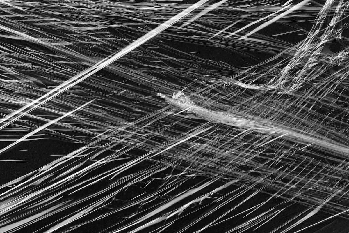 Black Plastic, high-contrast black and white abstract pattern, tangled glowing fiber strands, SD Desktop Wallpaper