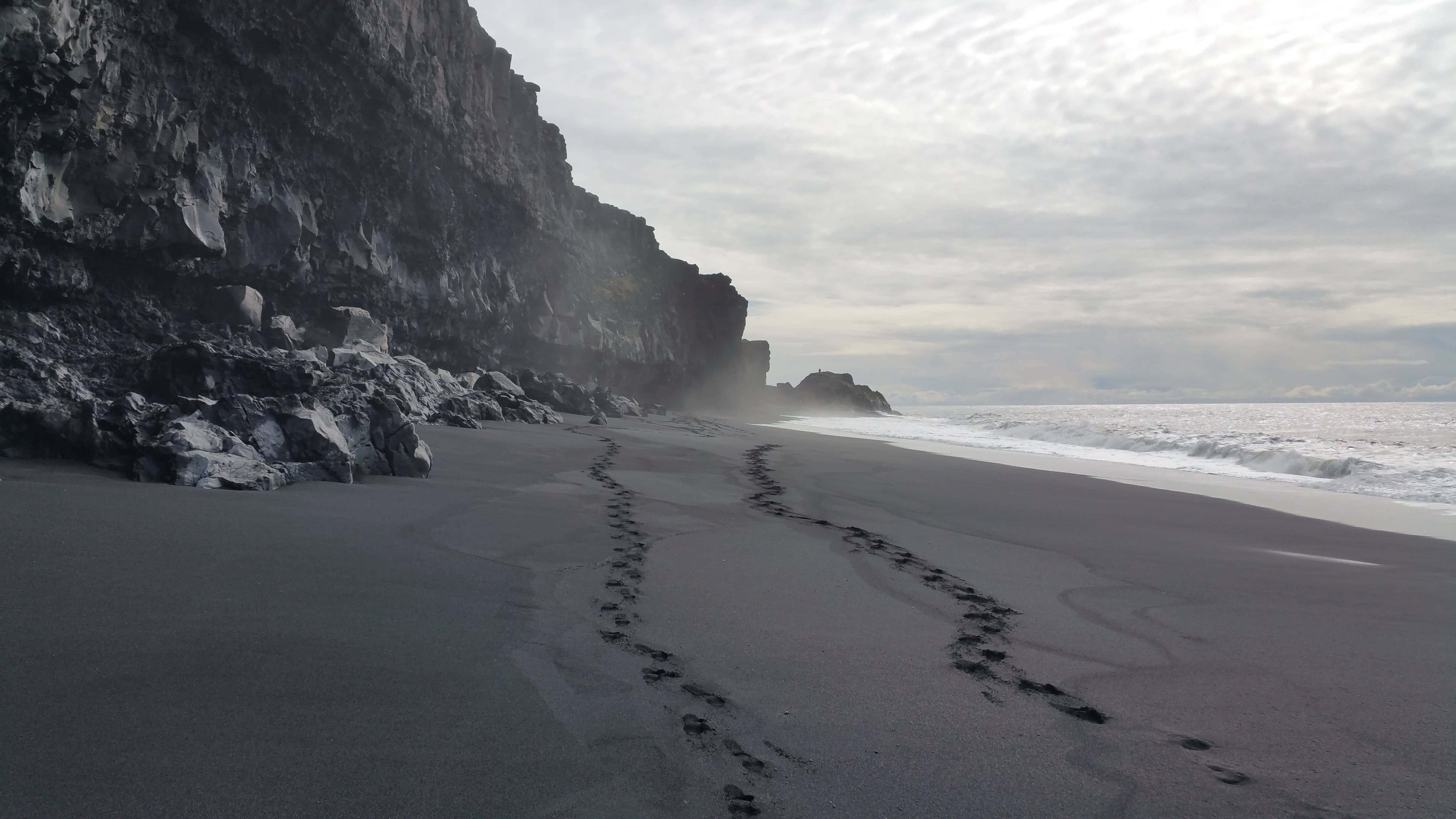 black sand beach, misty black sand beach, towering volcanic cliffs, 5K Desktop Wallpaper