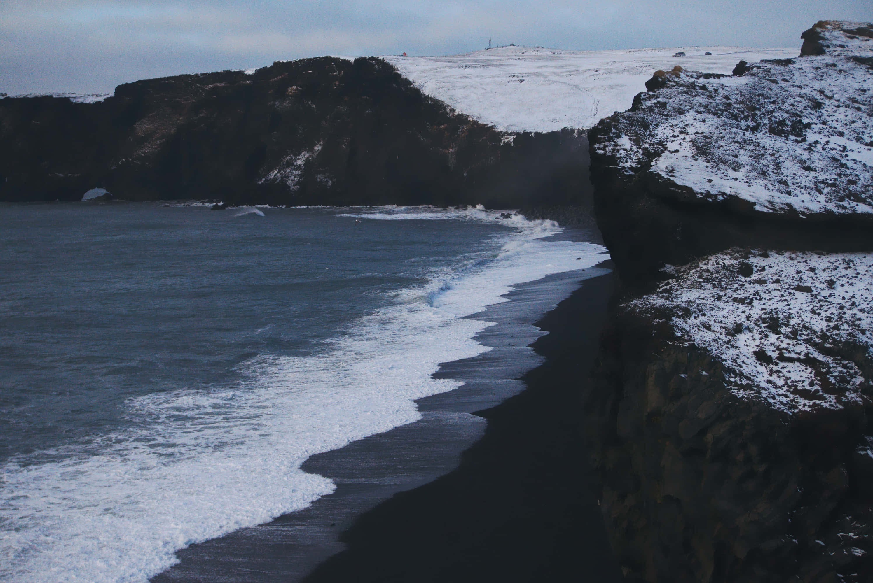 Black Sand Beach, volcanic beach, snow-dusted cliffs, 2K Desktop Wallpaper