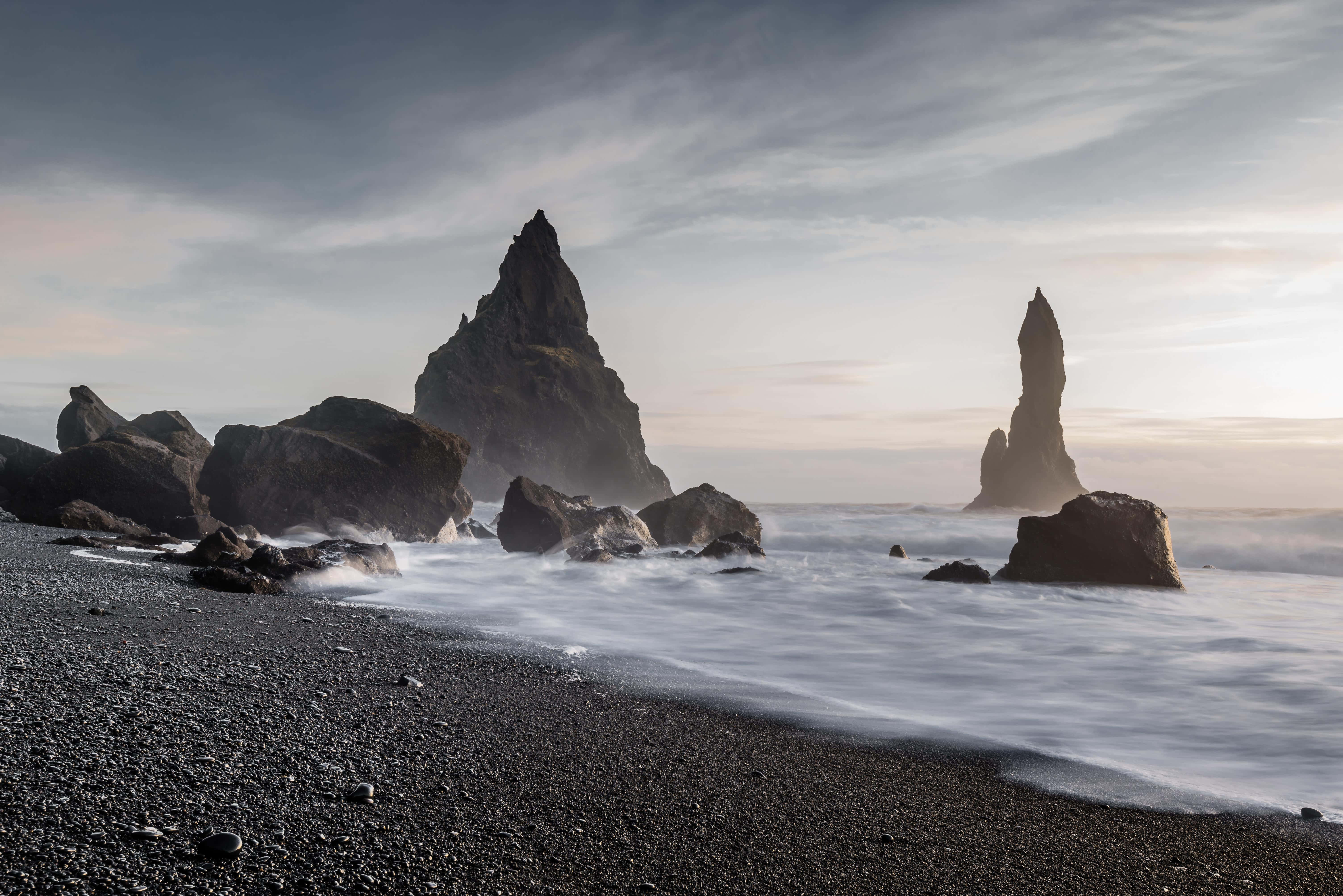 black sand beach, misty dawn light, jagged sea stacks, 5K Desktop Wallpaper