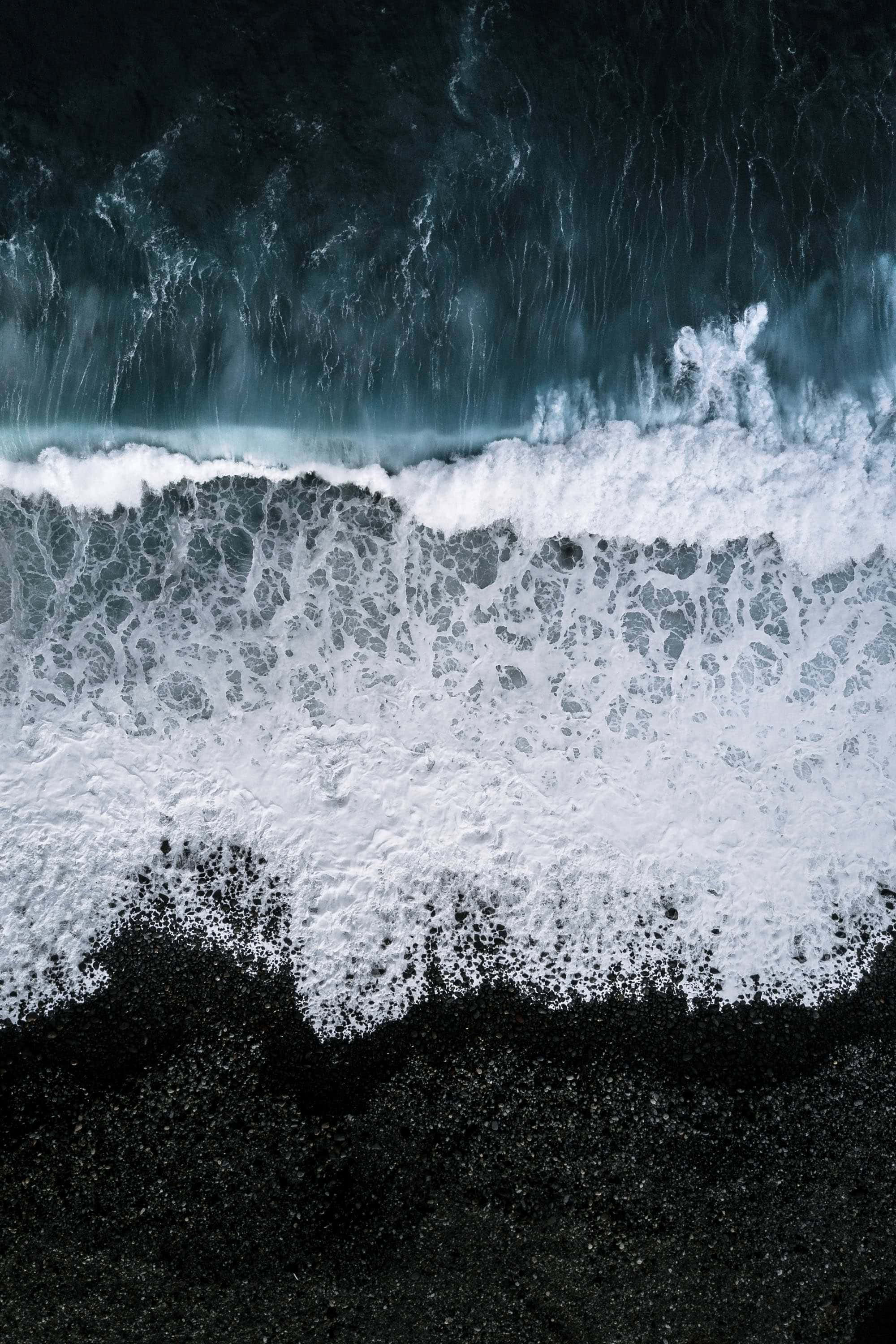 black sand beach, aerial view, crashing ocean waves, 2K Phone Wallpaper