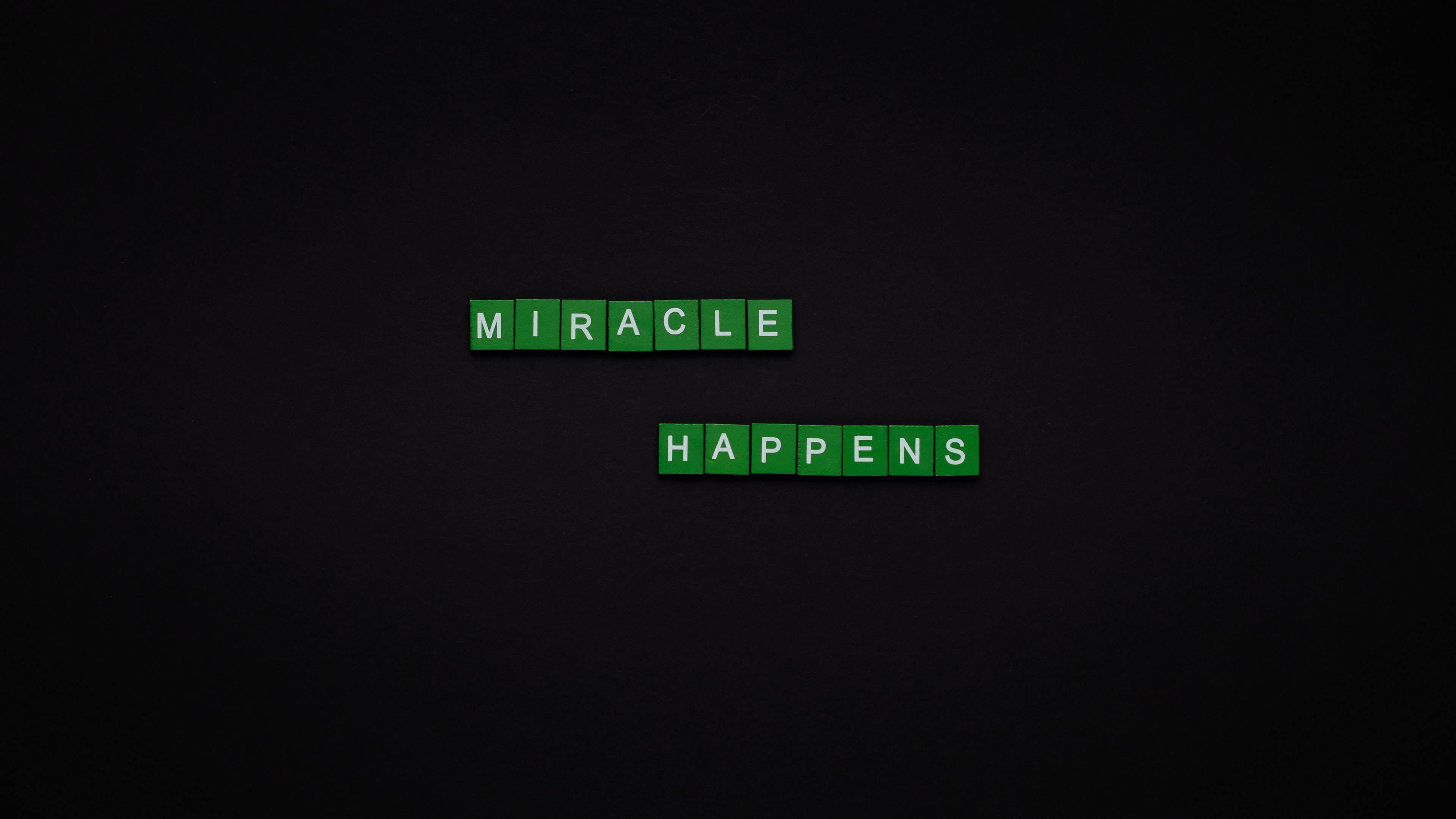 Green scrabble tiles, miracle happens, dark textured background, 4K Desktop Wallpaper