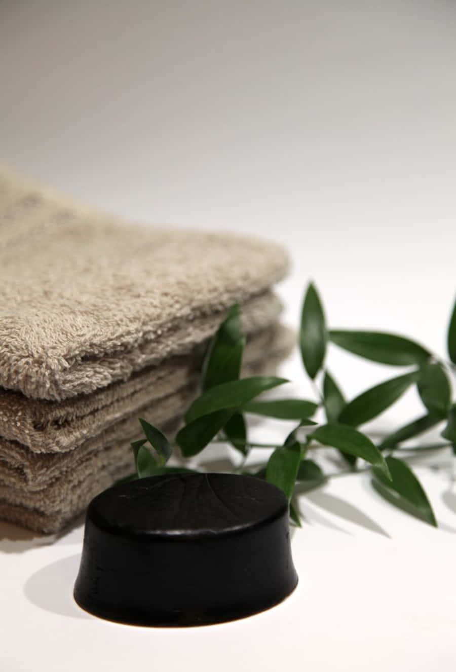 Black Soap, black soap bar, fresh green leaves, HD Phone Wallpaper