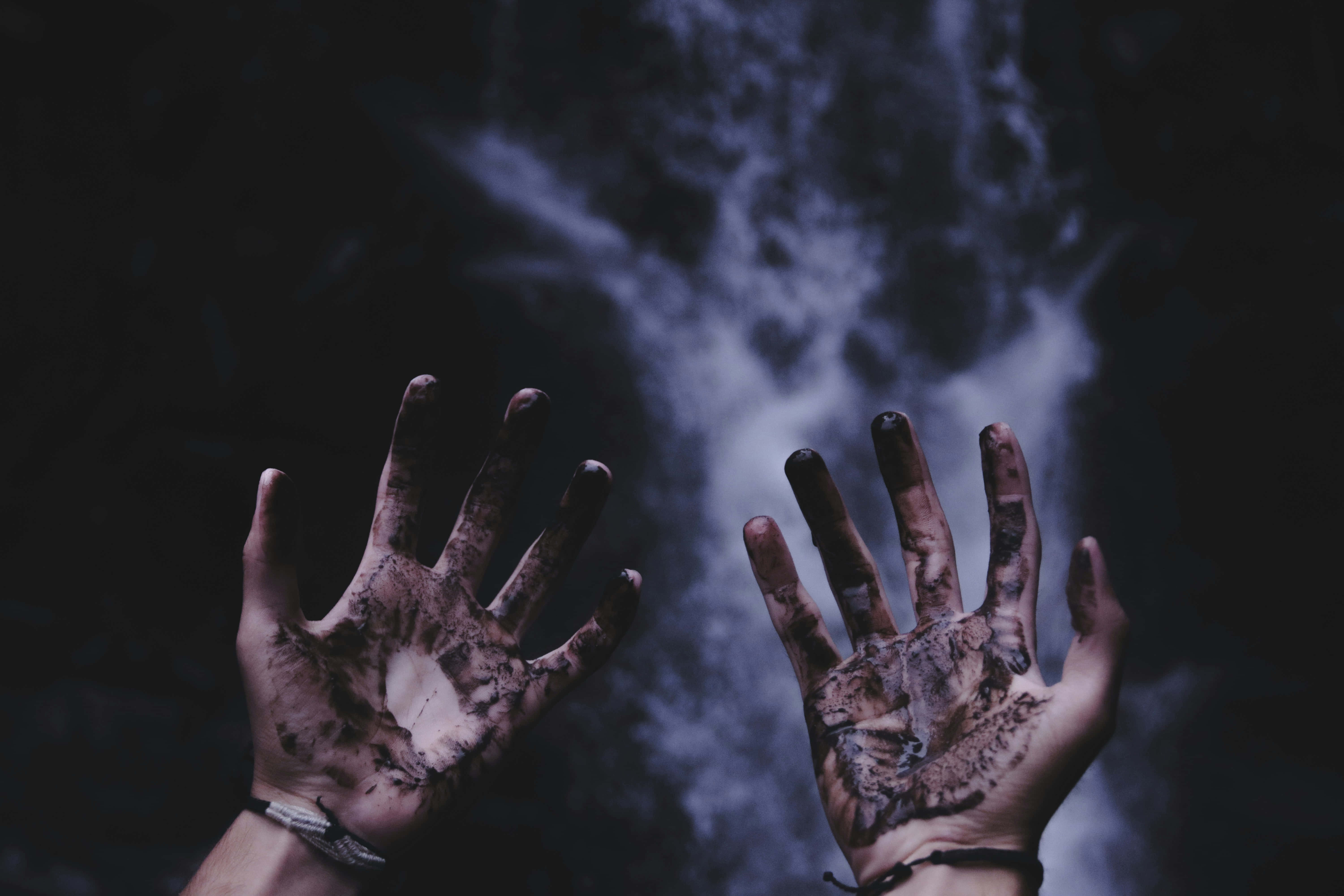 muddy hands, dark backdrop, swirling mist, 5K Desktop Wallpaper