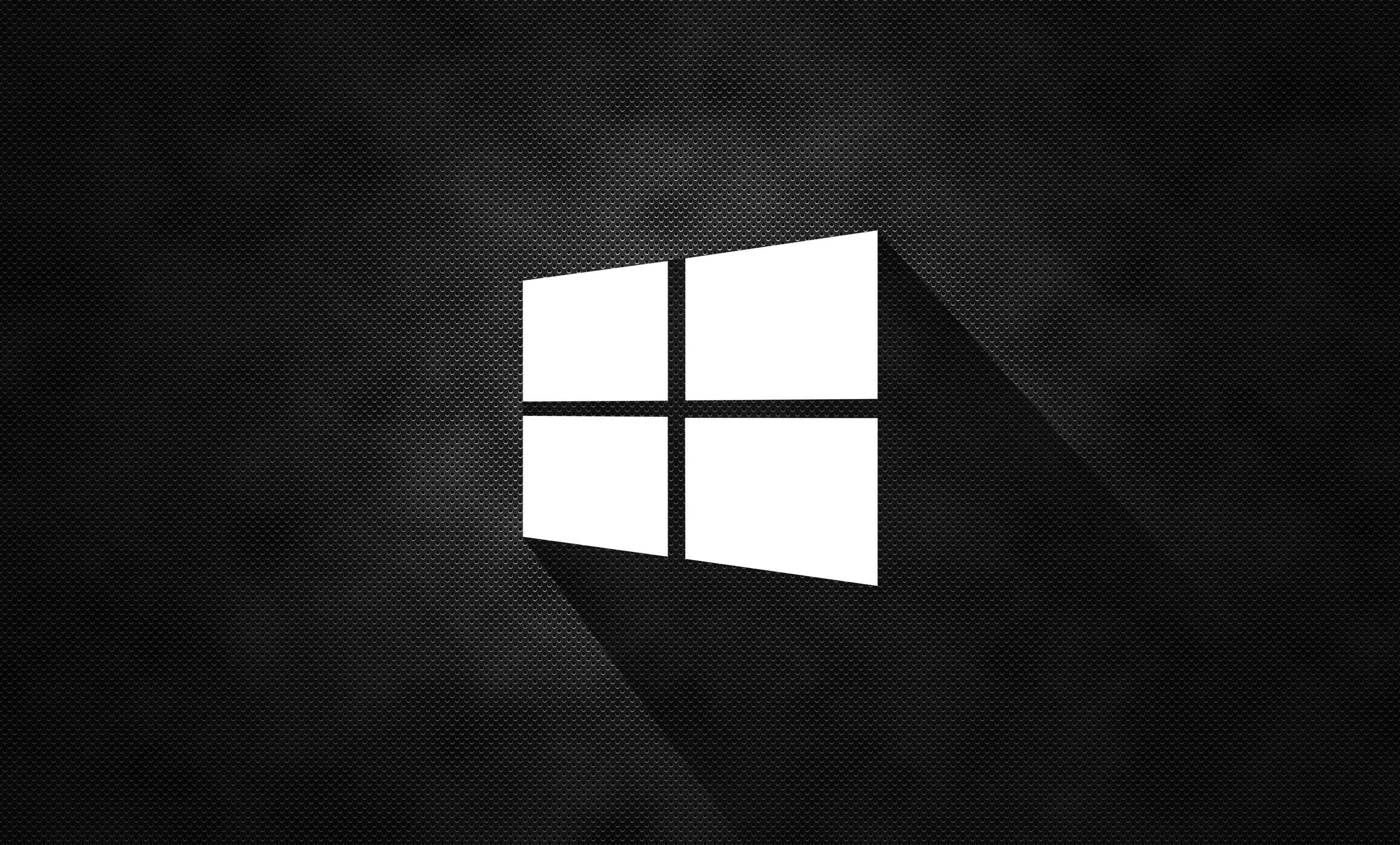 Windows logo, textured black background, subtle gradient lighting, 2K Desktop Wallpaper