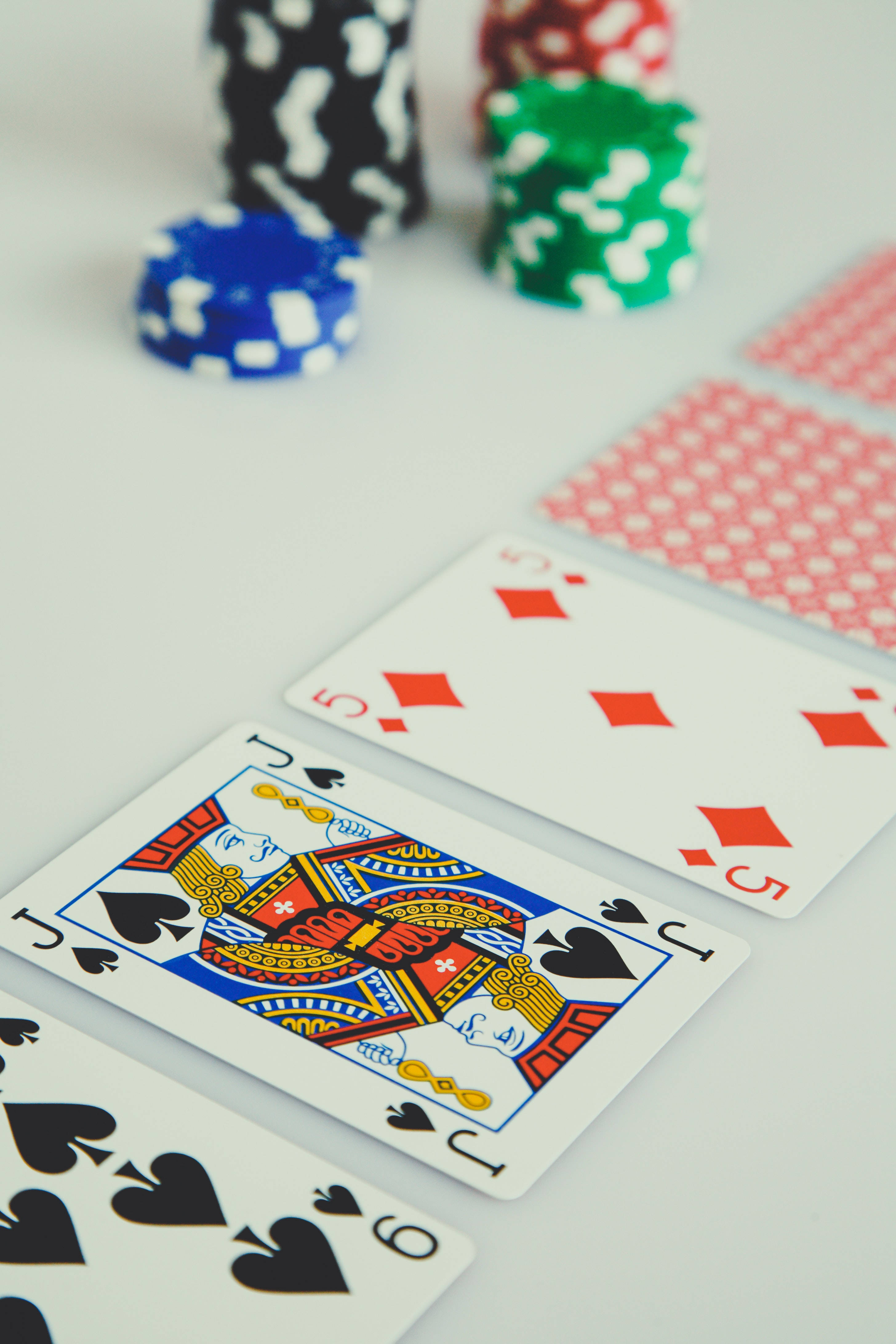 playing cards, poker chips, white surface, 4K Phone Wallpaper