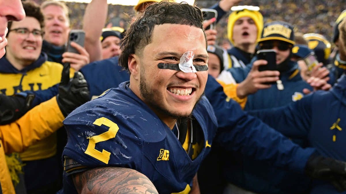 Blake Corum, blue jersey, number two, SD Desktop Wallpaper