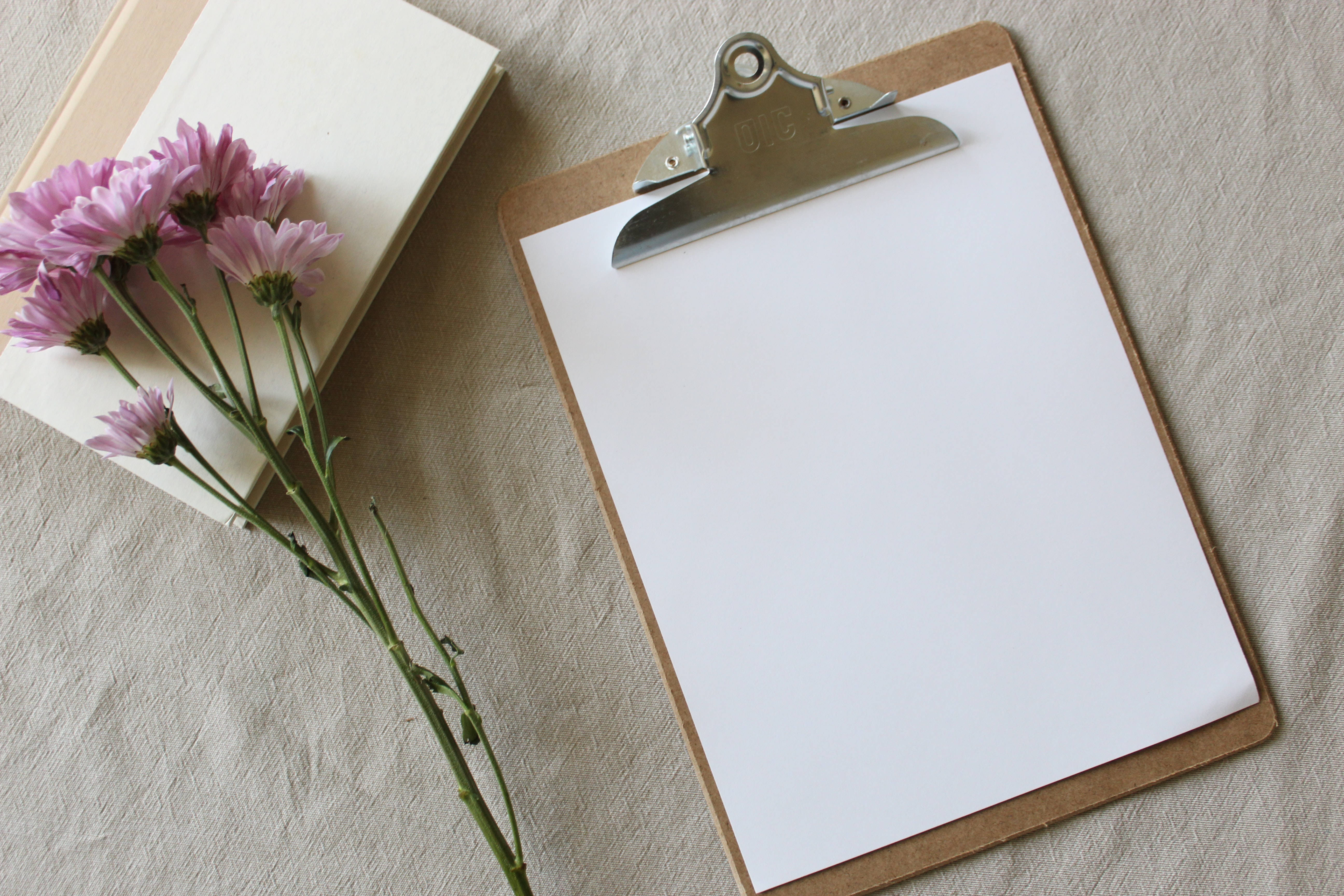 blank clipboard, textured beige fabric, pink flowers, 5K Desktop Wallpaper