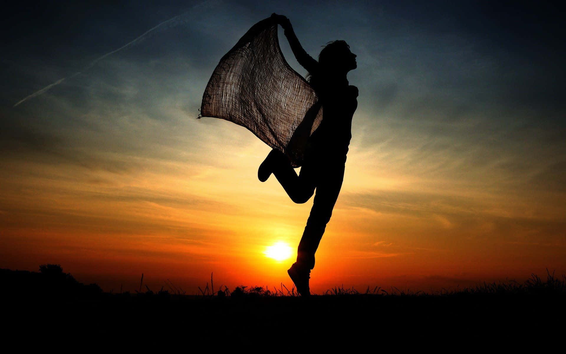 vibrant sunset sky, silhouetted person, leaps joyfully, Full HD Desktop Wallpaper