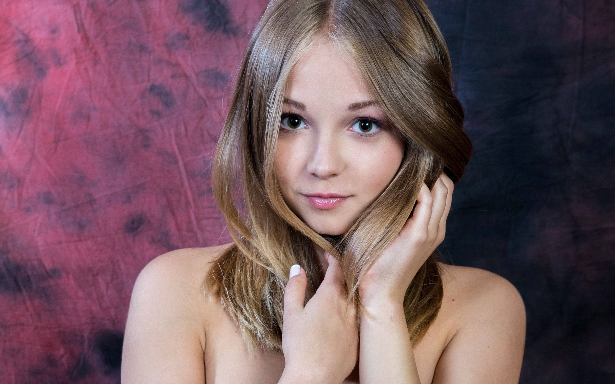 blonde female model, red and black backdrop, textured backdrop, 2K Desktop Wallpaper