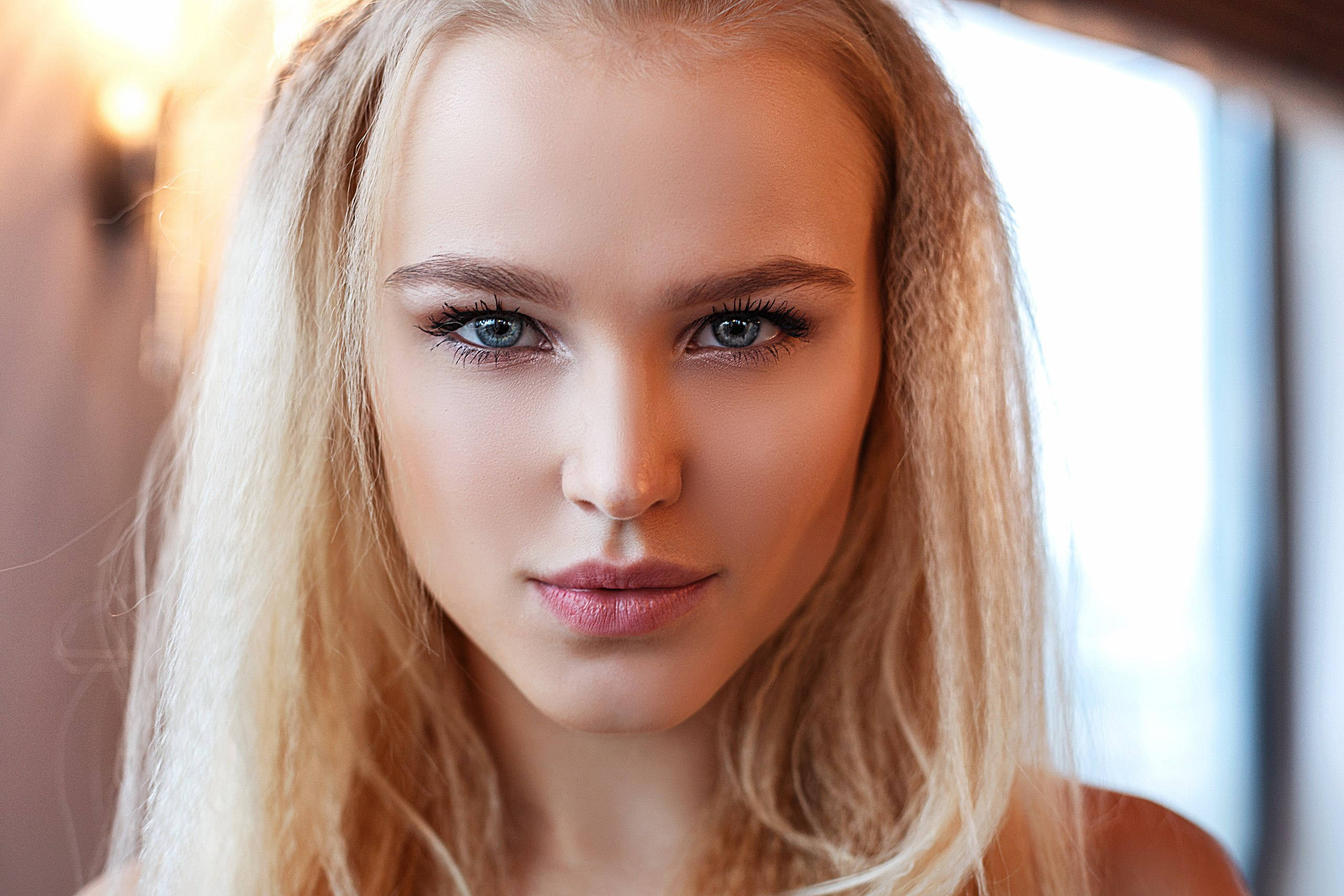 blonde woman, fierce look, striking blue eyes, 2K Desktop Wallpaper