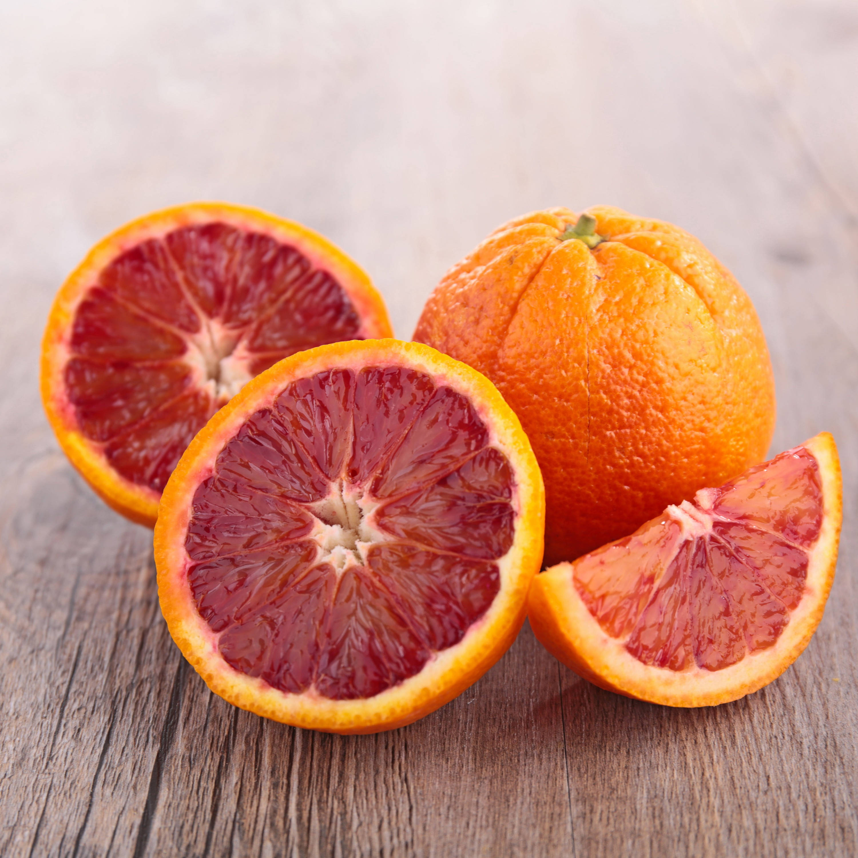 Blood Orange, crimson flesh, rustic wooden surface, 2K Desktop Wallpaper