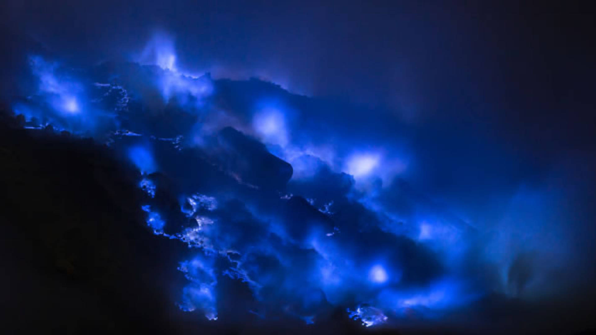Blue Flames Lights, glowing blue bioluminescent waves, dark volcanic rocks, Full HD Desktop Wallpaper
