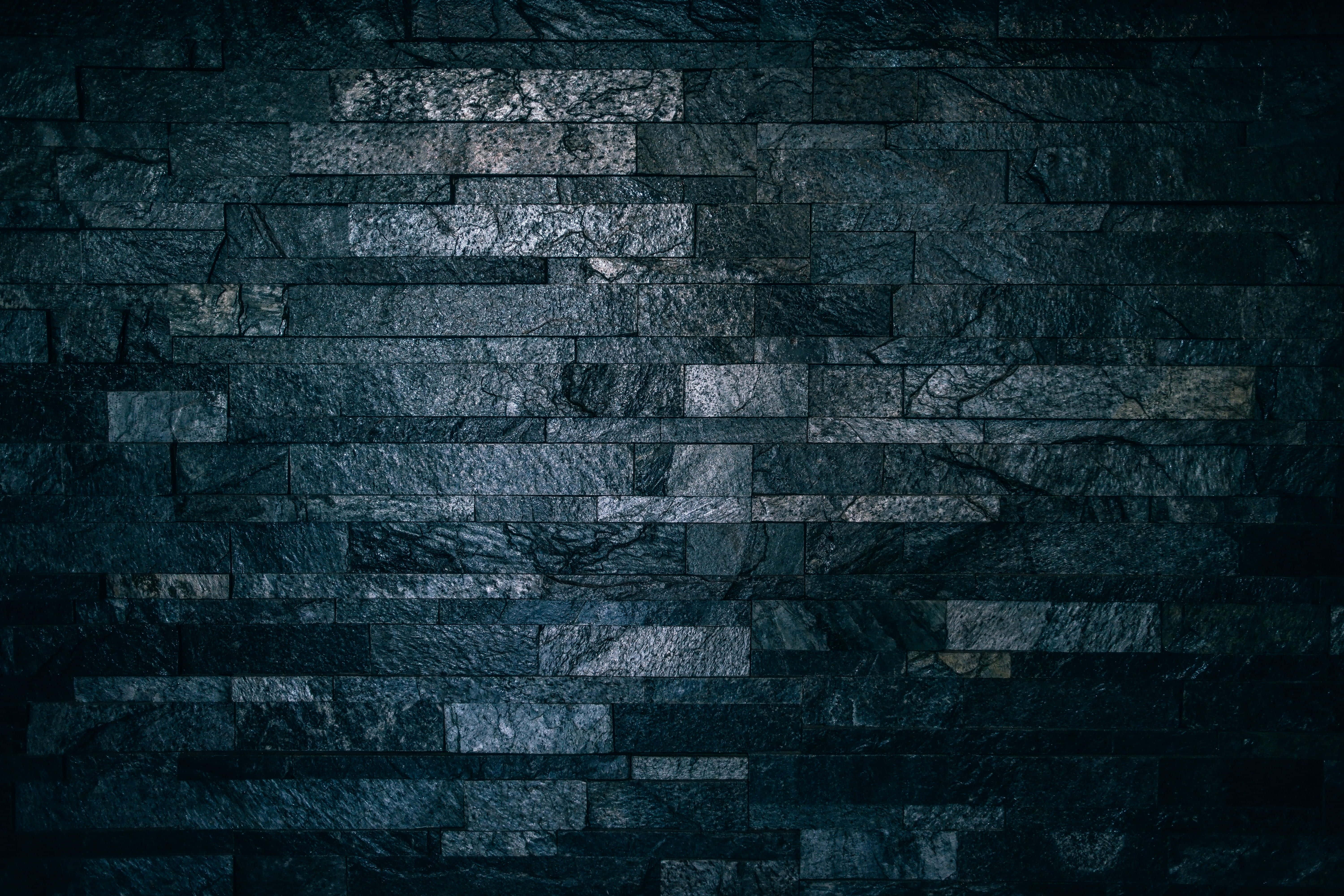 blue gray sky, dark textured stone wall, layered slate bricks, 5K Desktop Wallpaper