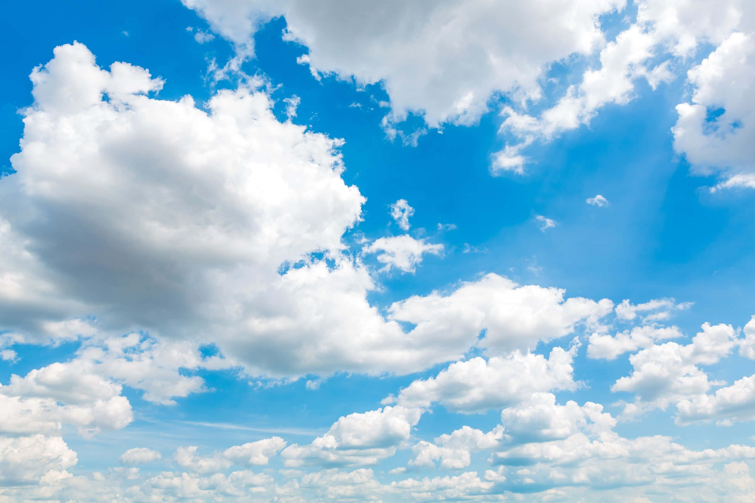 Blue Horizon, vast blue sky, fluffy white clouds, 2K Desktop Wallpaper