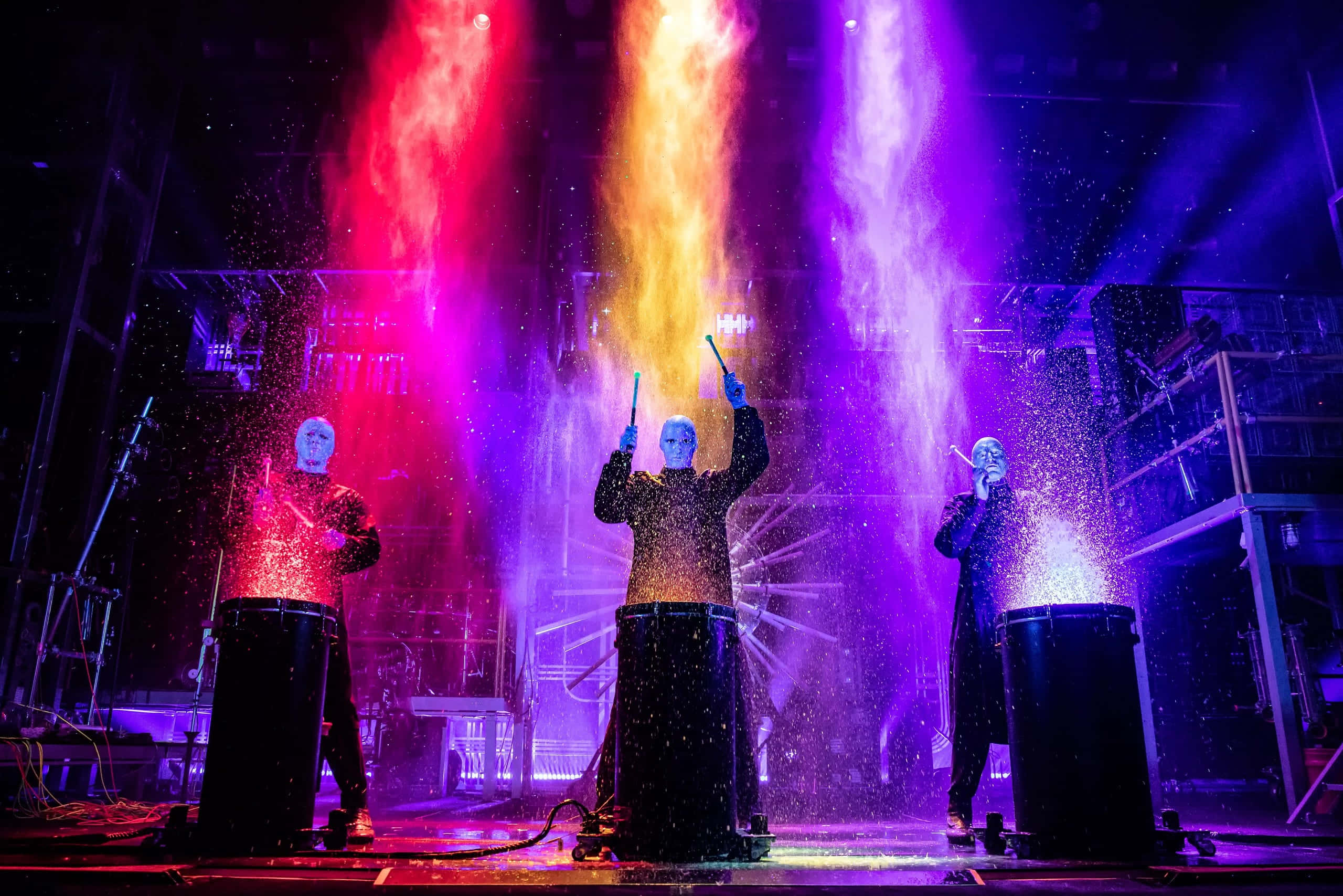 Blue Man Group, red purple and yellow lights, glittering sparks, 2K Desktop Wallpaper