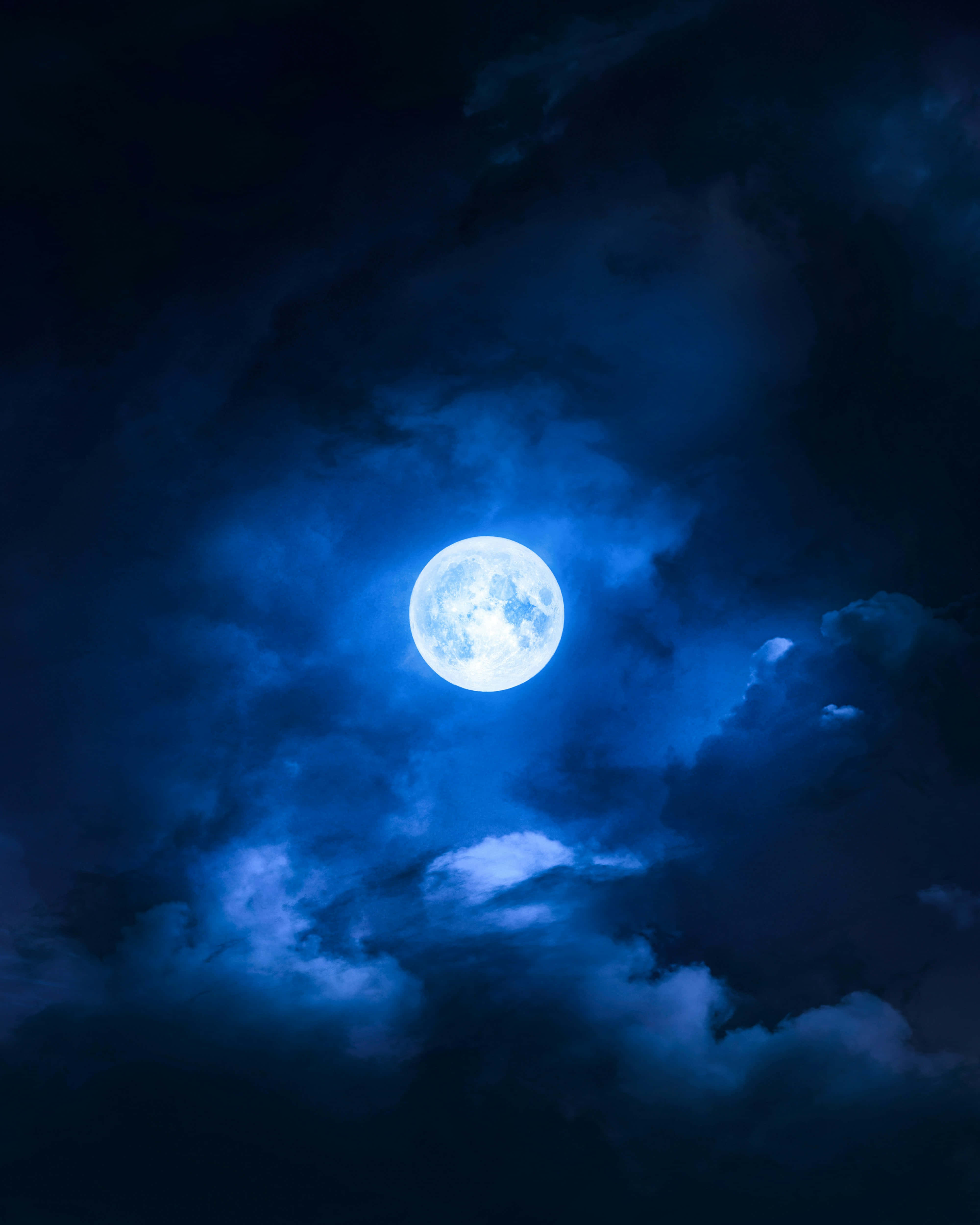 luminous blue moon, swirling dark blue clouds, deep night sky, 4K Phone Wallpaper