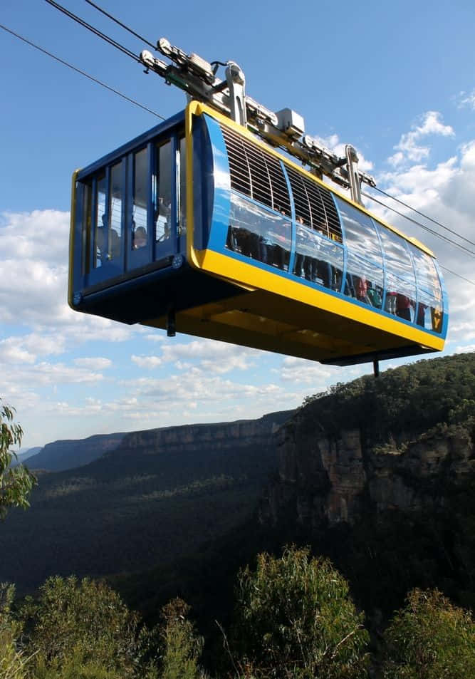 Blue Mountains, blue and yellow cable car, lush green canyon, SD Phone Wallpaper
