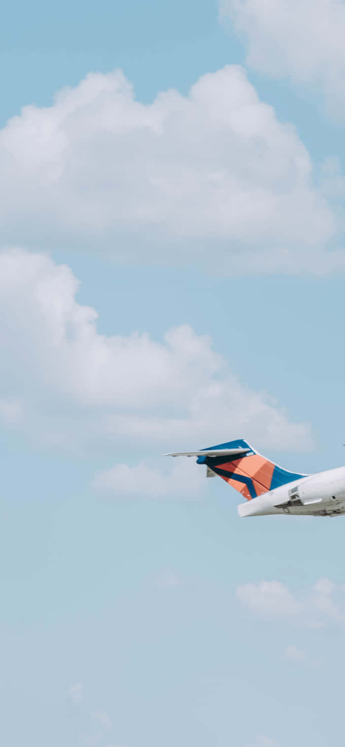 vibrant airplane tail, blue and orange livery, soft blue sky, HD Phone Wallpaper
