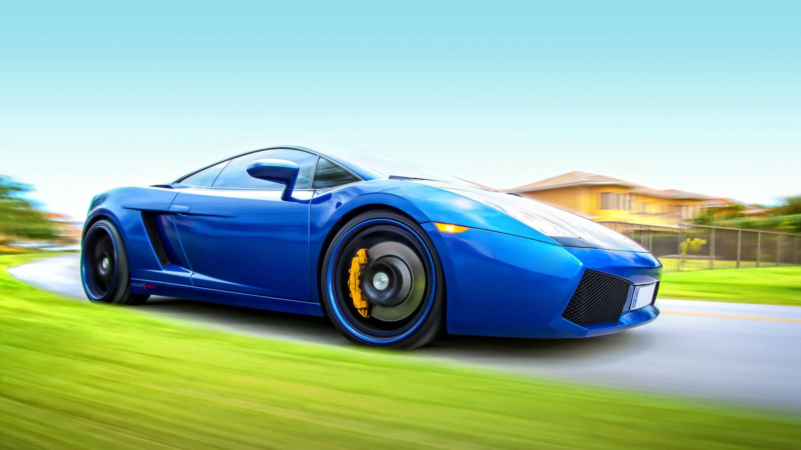 blue sports car, suburban road, blurred green grass, 2K Desktop Wallpaper