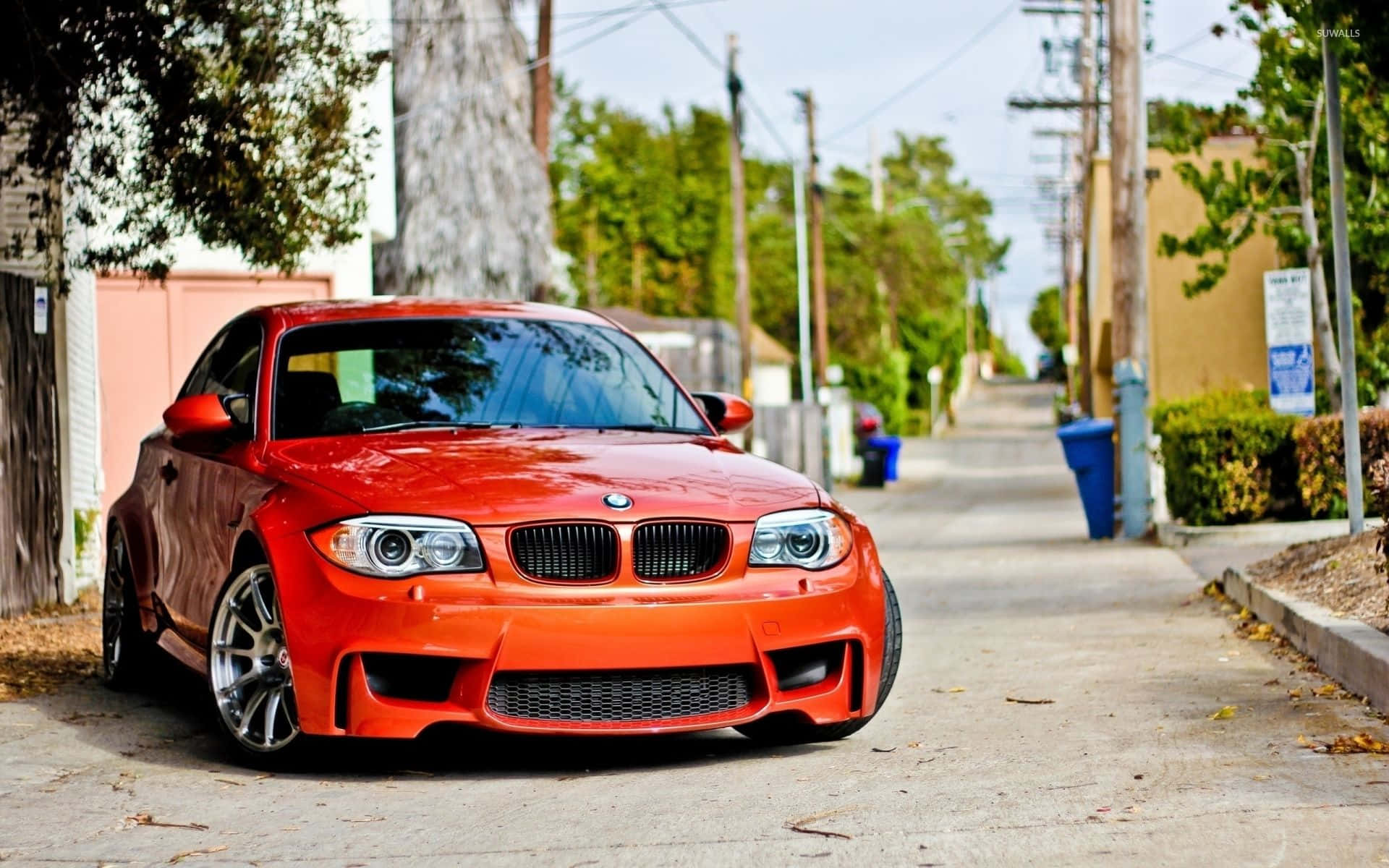 BMW 1 Series, vibrant orange, quiet residential street, Full HD Desktop Wallpaper