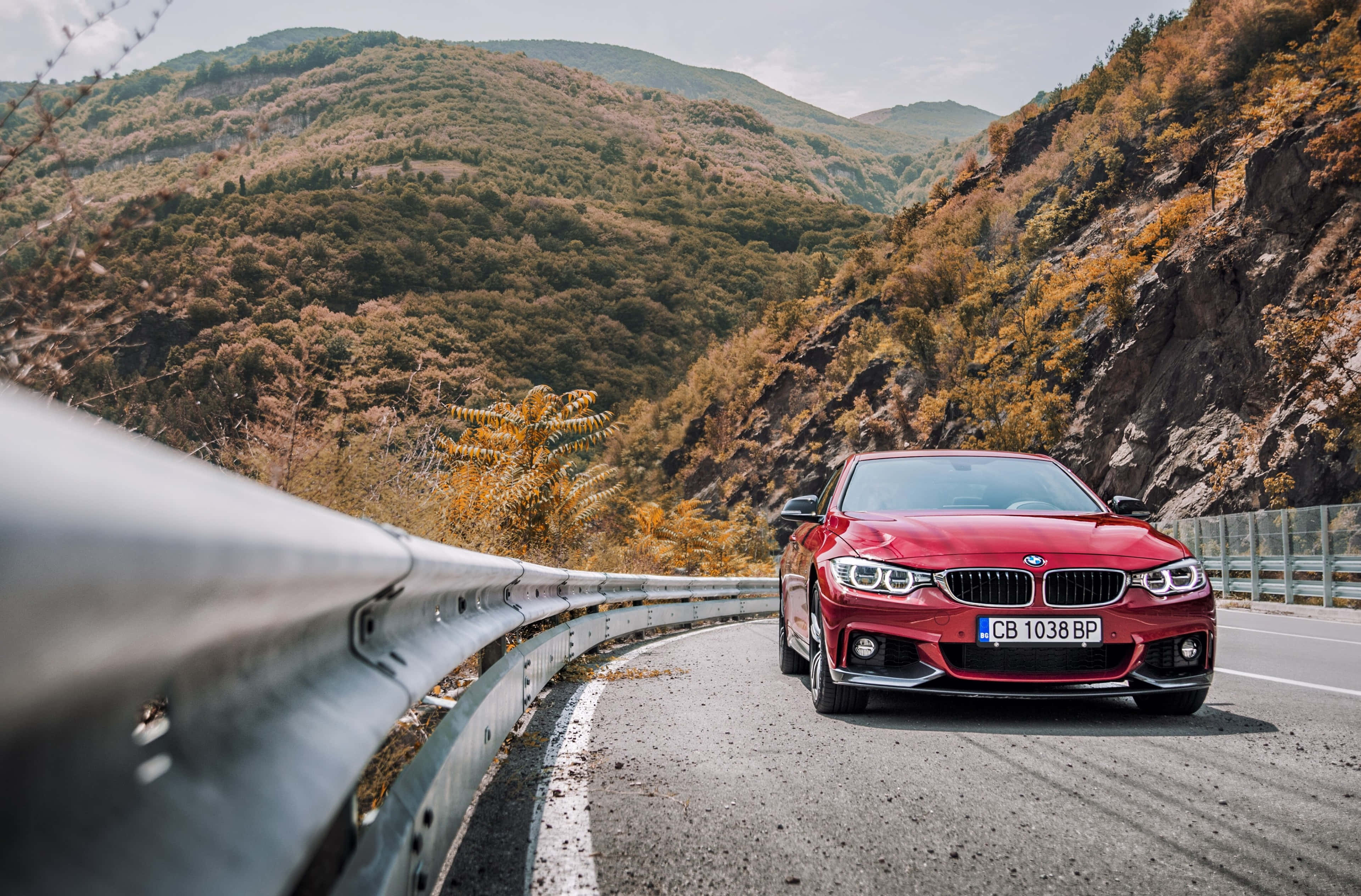 BMW 440i, vibrant red, winding mountain road, 4K Desktop Wallpaper