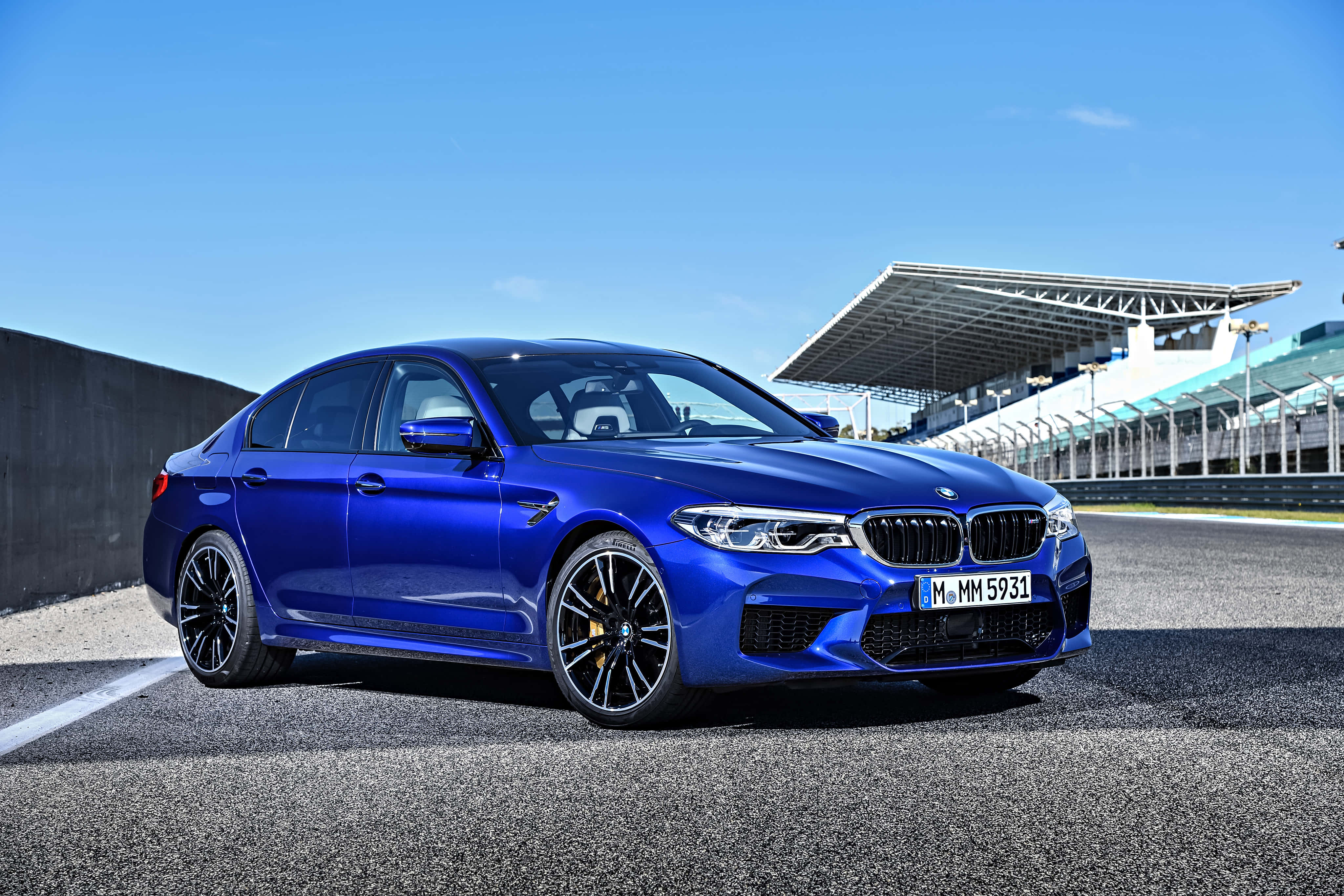 BMW M5, vibrant blue, asphalt racetrack, 4K Desktop Wallpaper
