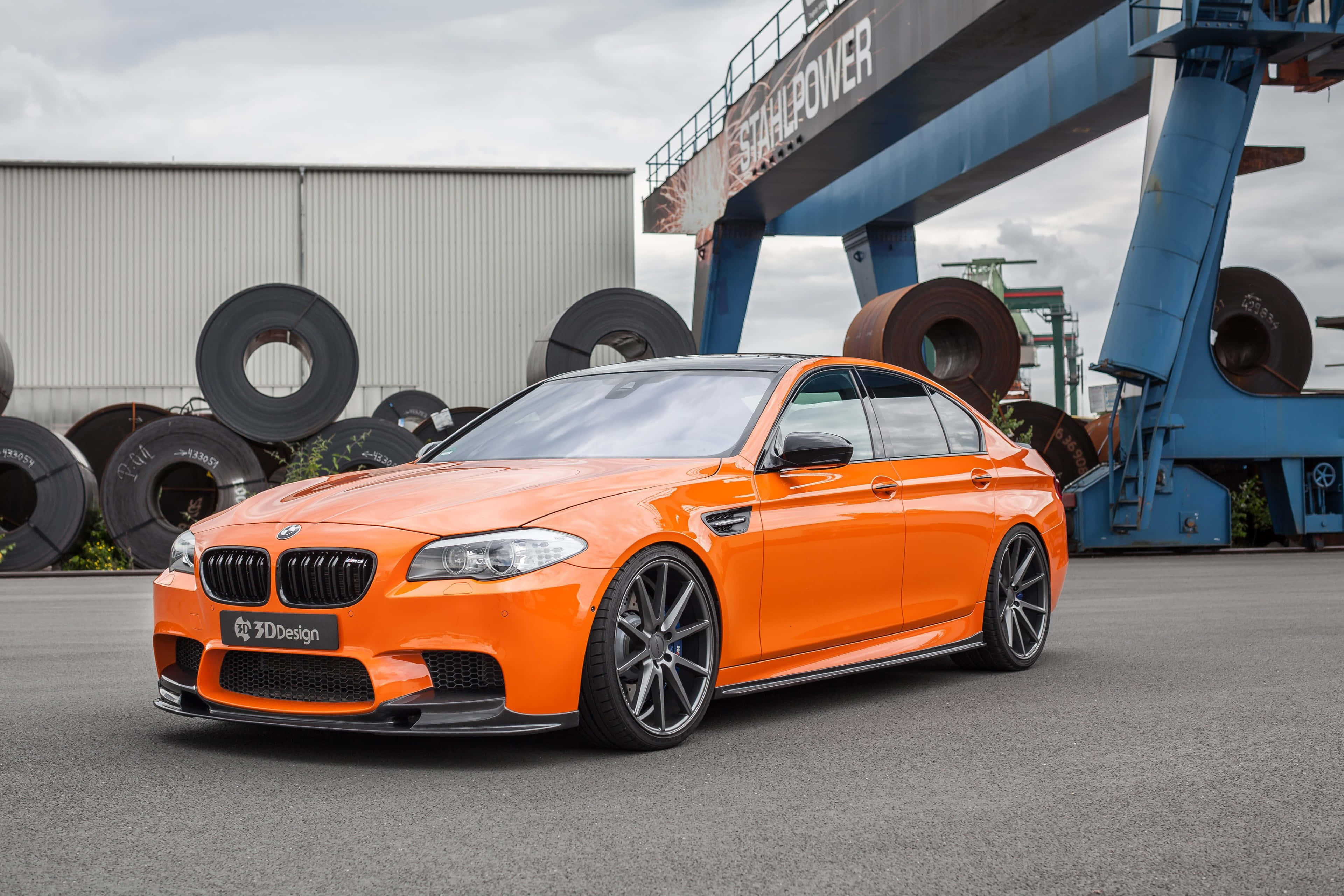 BMW M5, vibrant orange, industrial yard, 4K Desktop Wallpaper