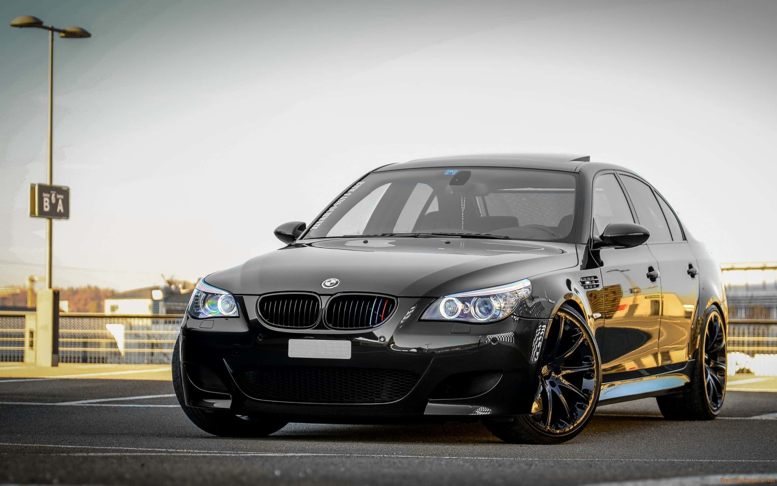BMW M5, black, asphalt lot, 2K Desktop Wallpaper