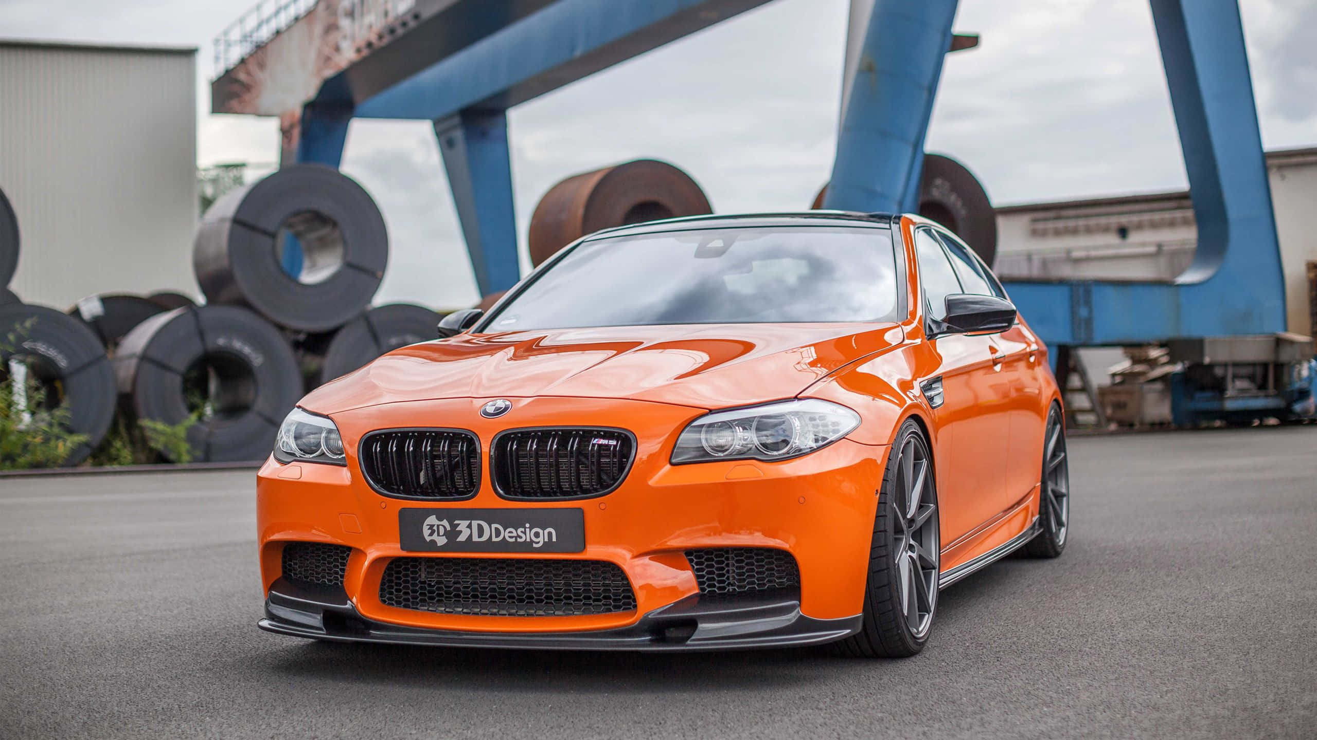 BMW M5, vibrant orange, black accents, 2K Desktop Wallpaper