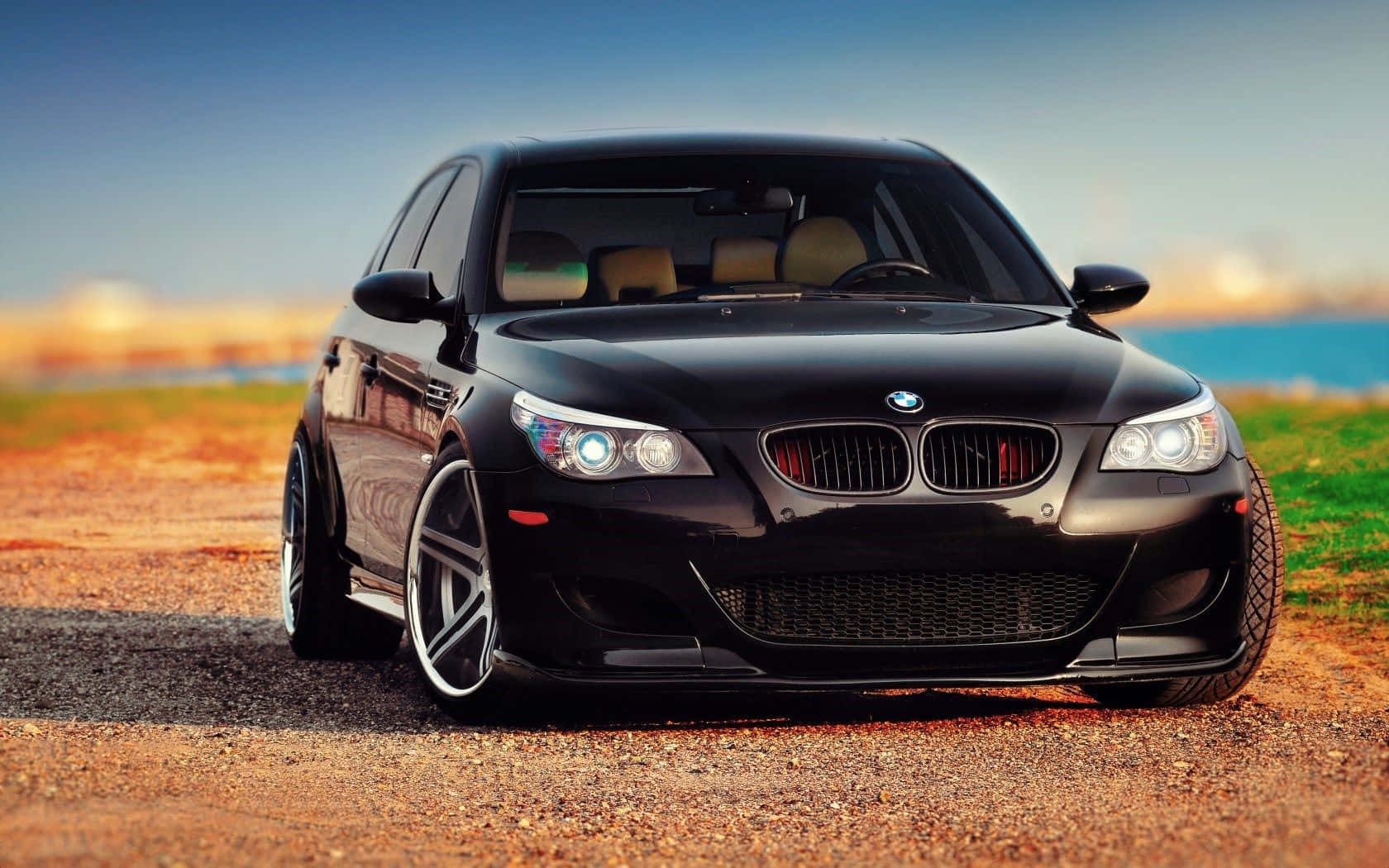 BMW M5, glossy black, gravel road, HD Desktop Wallpaper