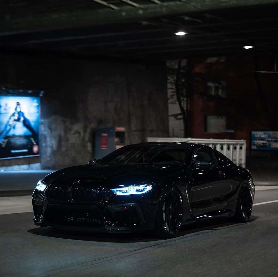 BMW M8, sleek black sports car, dimly lit urban tunnel, SD Desktop Wallpaper