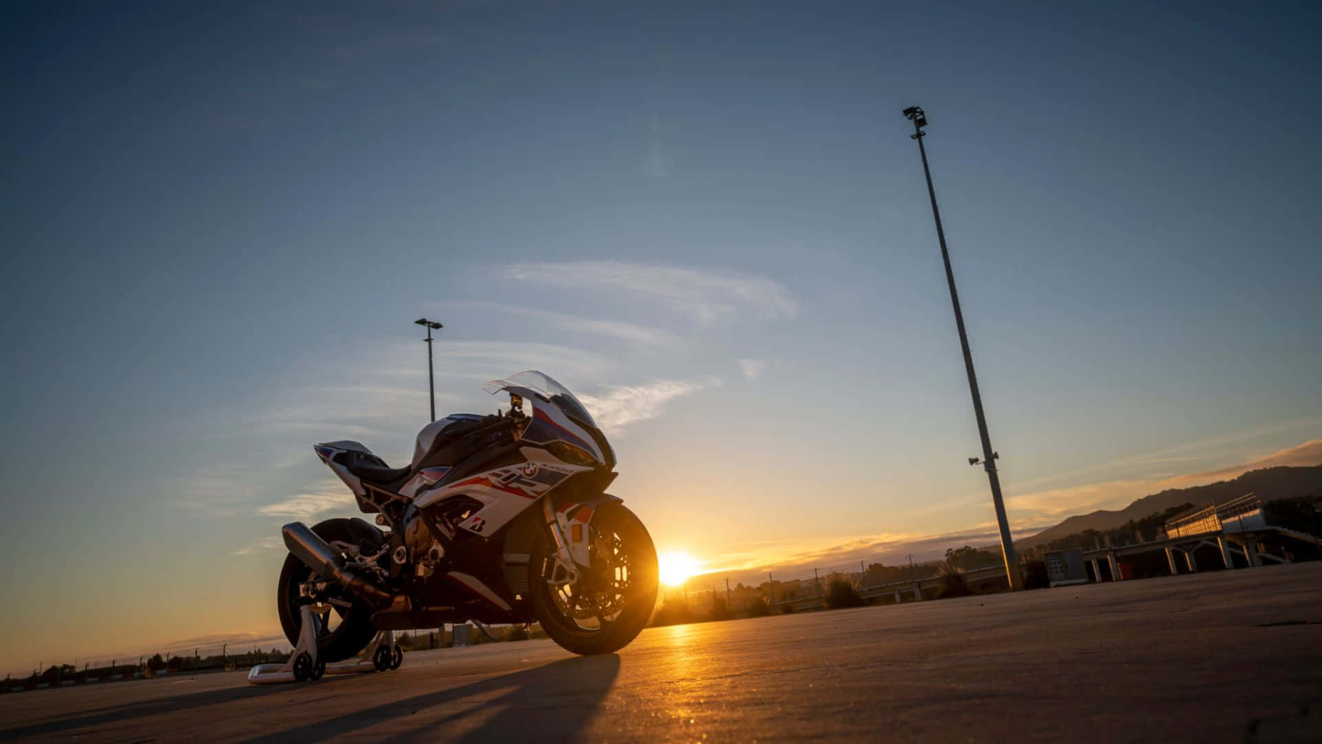 BMW S1000RR, sunset, paved lot, Full HD Desktop Wallpaper