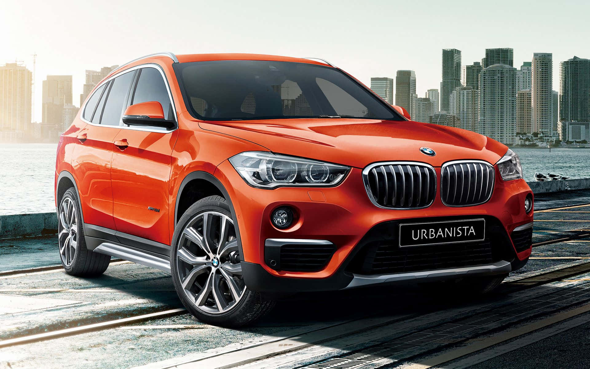 BMW X1, vibrant orange, waterfront promenade, Full HD Desktop Wallpaper