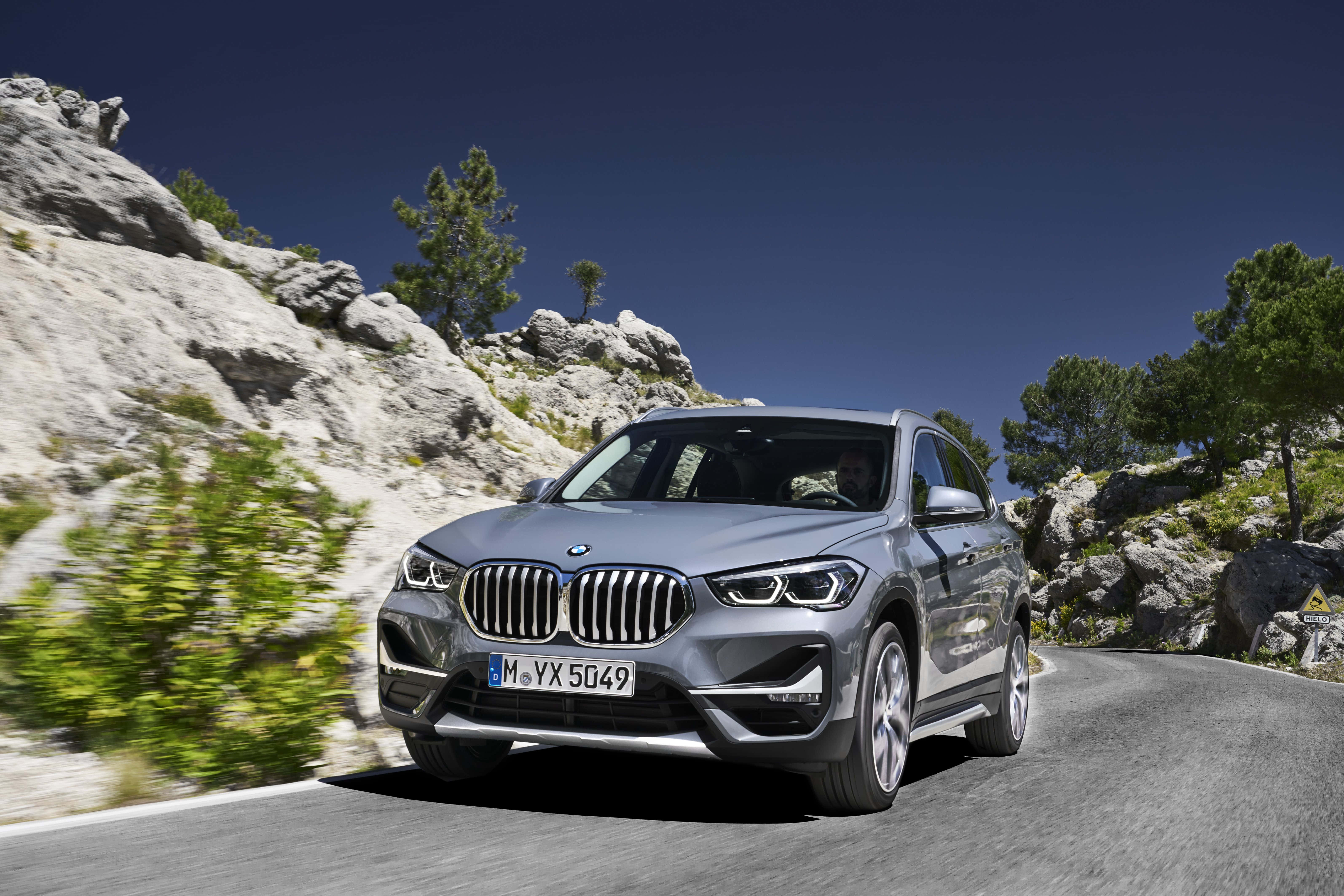 BMW X1, sleek silver, winding mountain road, 5K Desktop Wallpaper