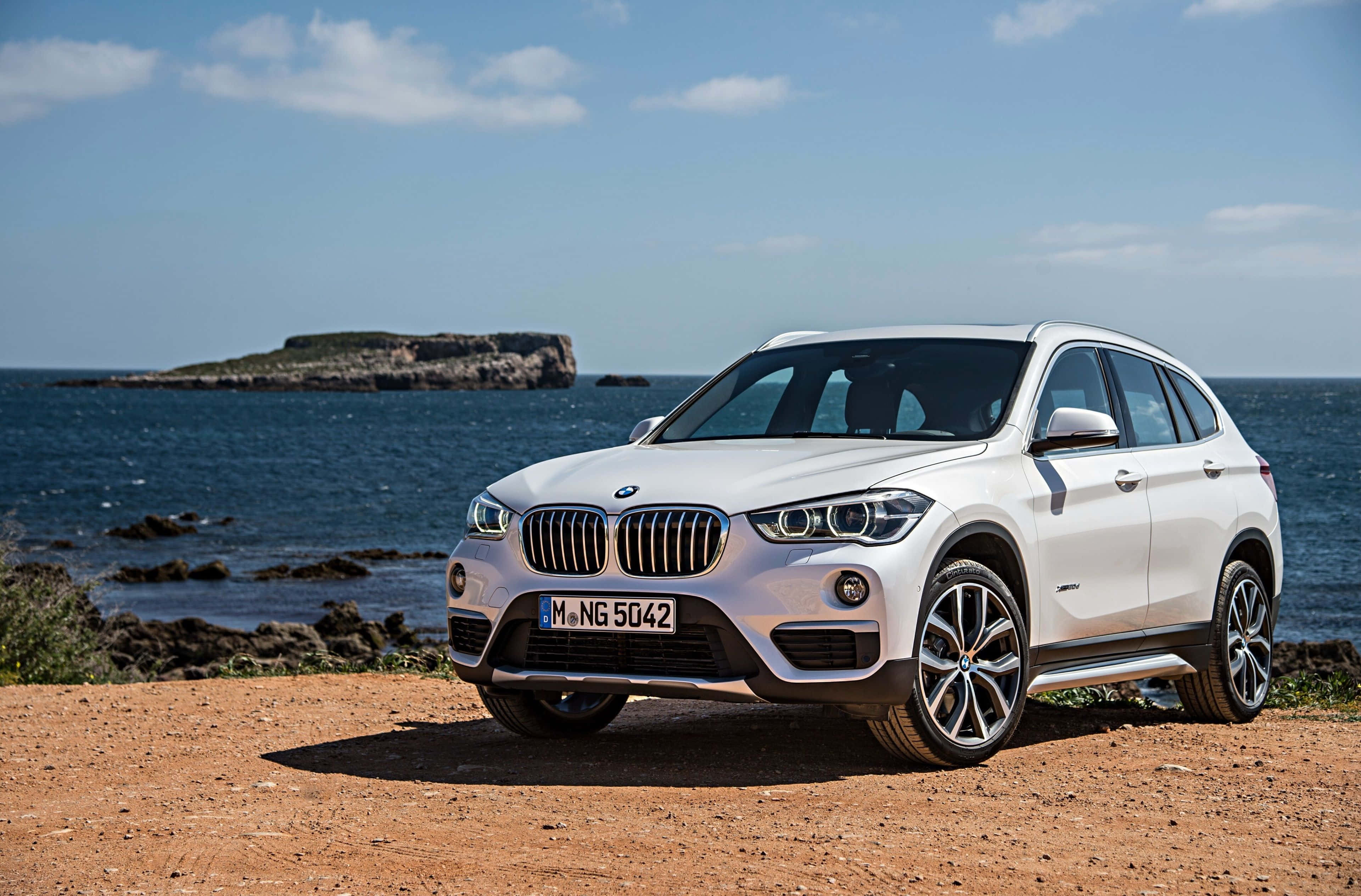 BMW X1, white, sunlit coastal cliff, 4K Desktop Wallpaper