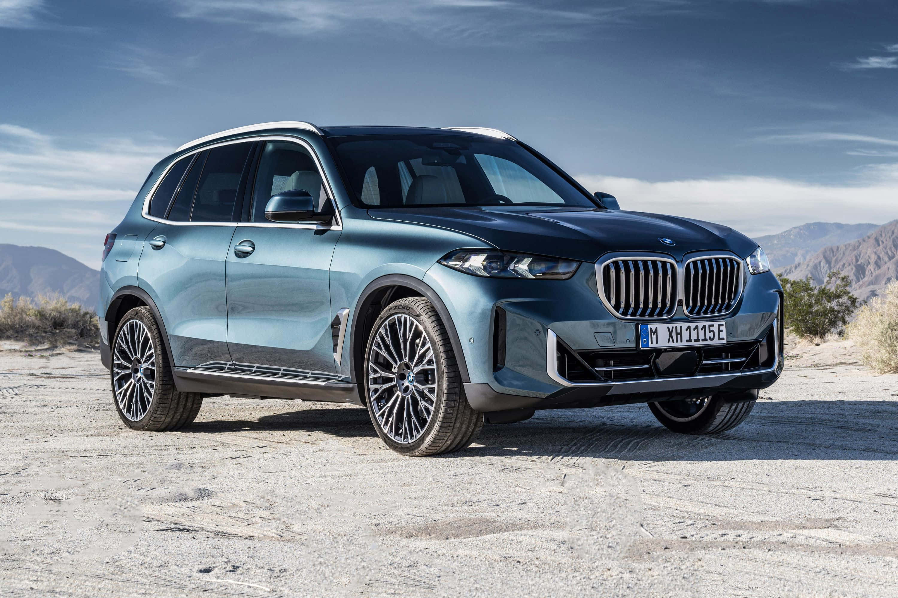 BMW X5, metallic blue, cracked desert pavement, 2K Desktop Wallpaper