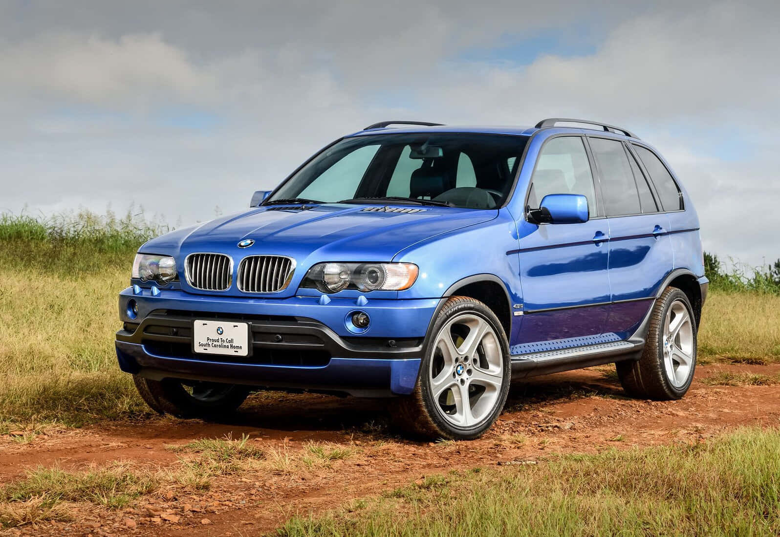 BMW X5, vibrant blue, dirt path, HD Desktop Wallpaper