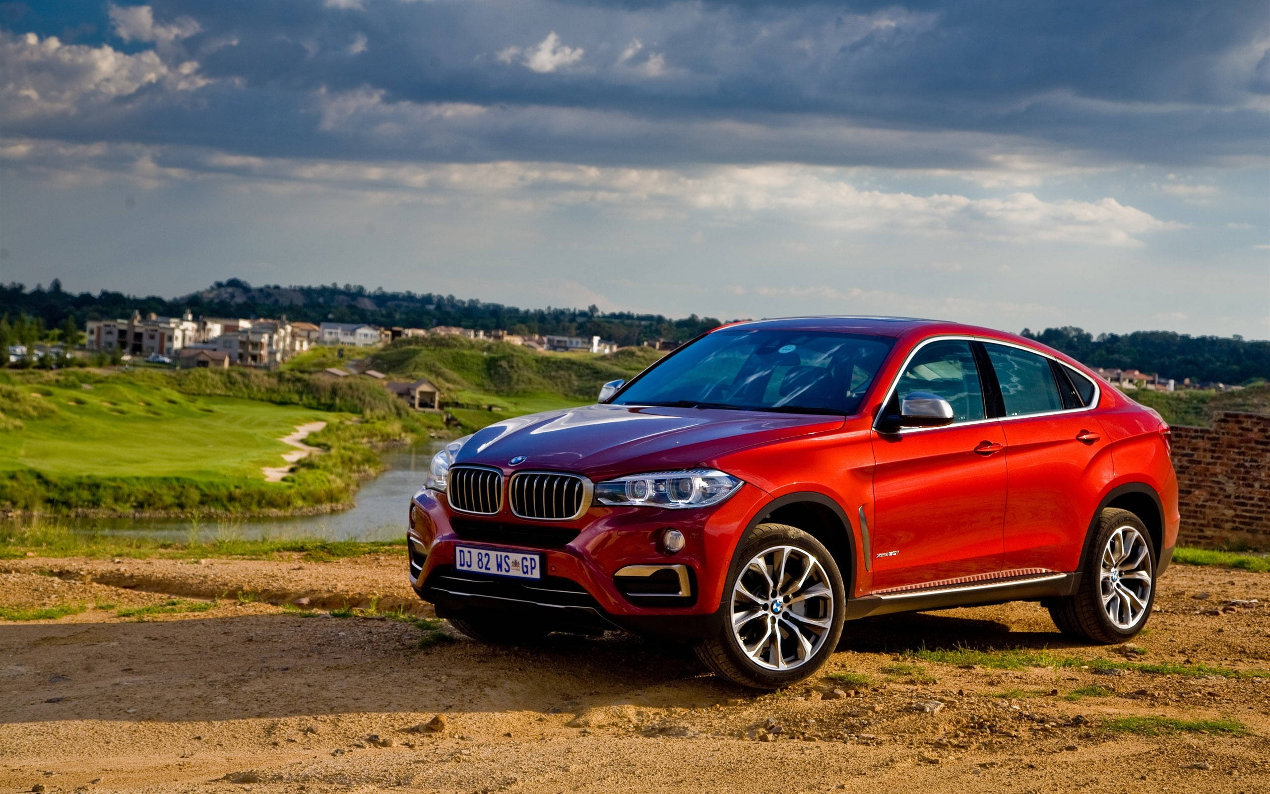 BMW X6 M, glossy red, dirt path, 2K Desktop Wallpaper