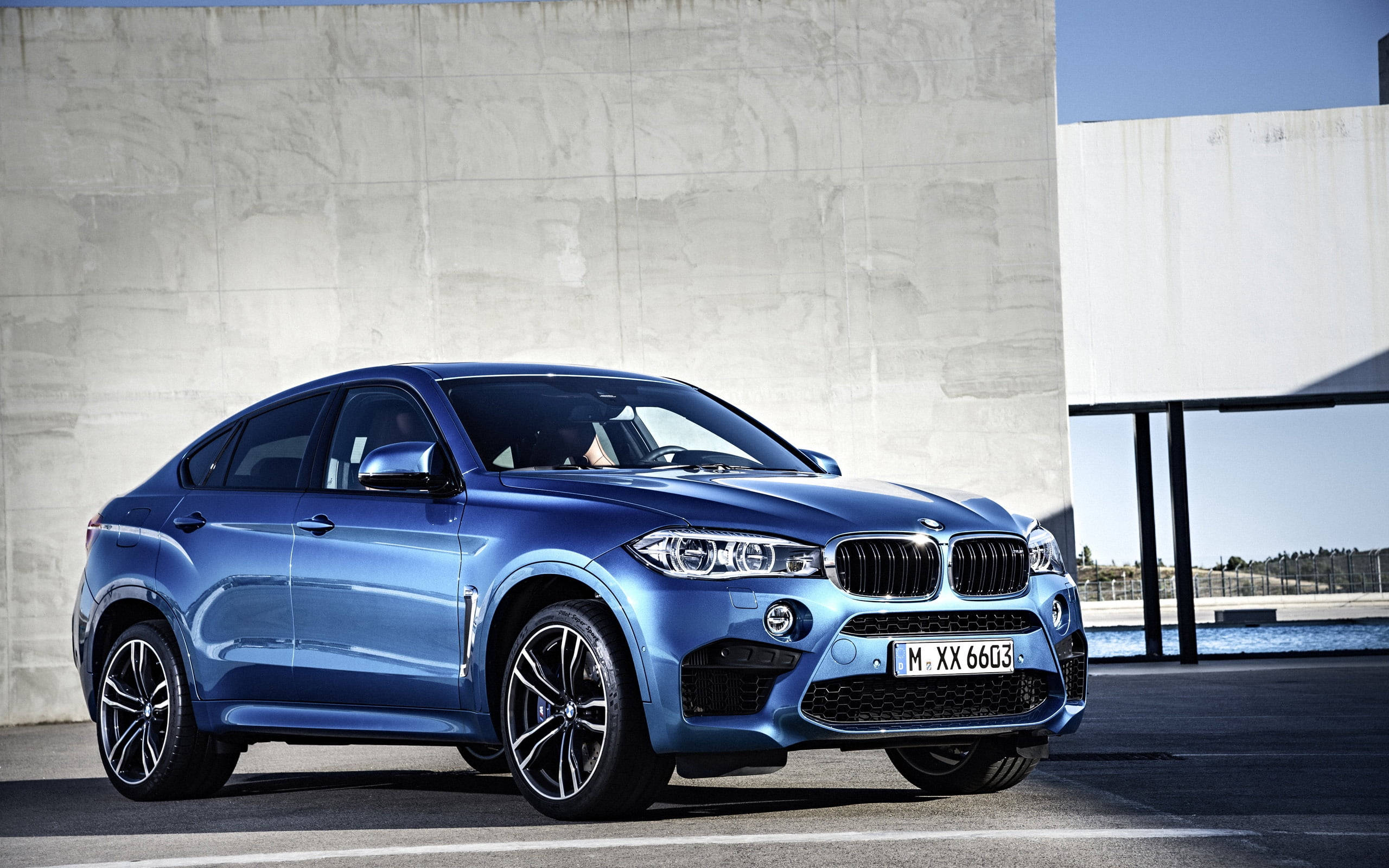 BMW X6 M, sleek blue, minimalist concrete wall, 2K Desktop Wallpaper