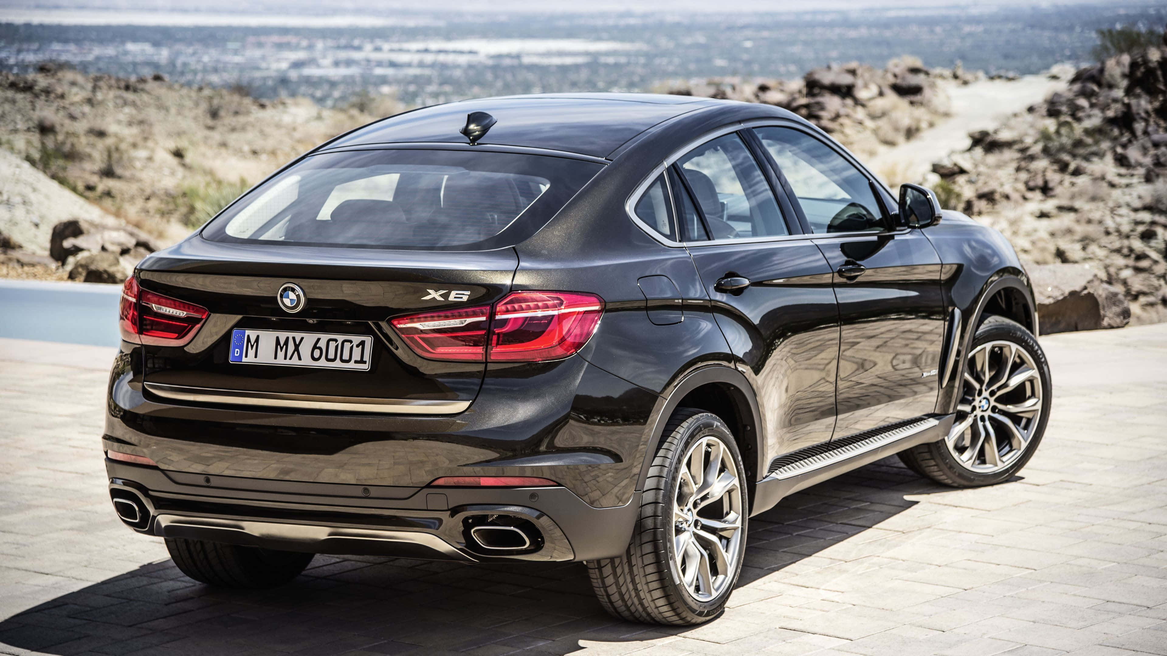 BMW X6, sleek black, stone overlook, 4K Desktop Wallpaper