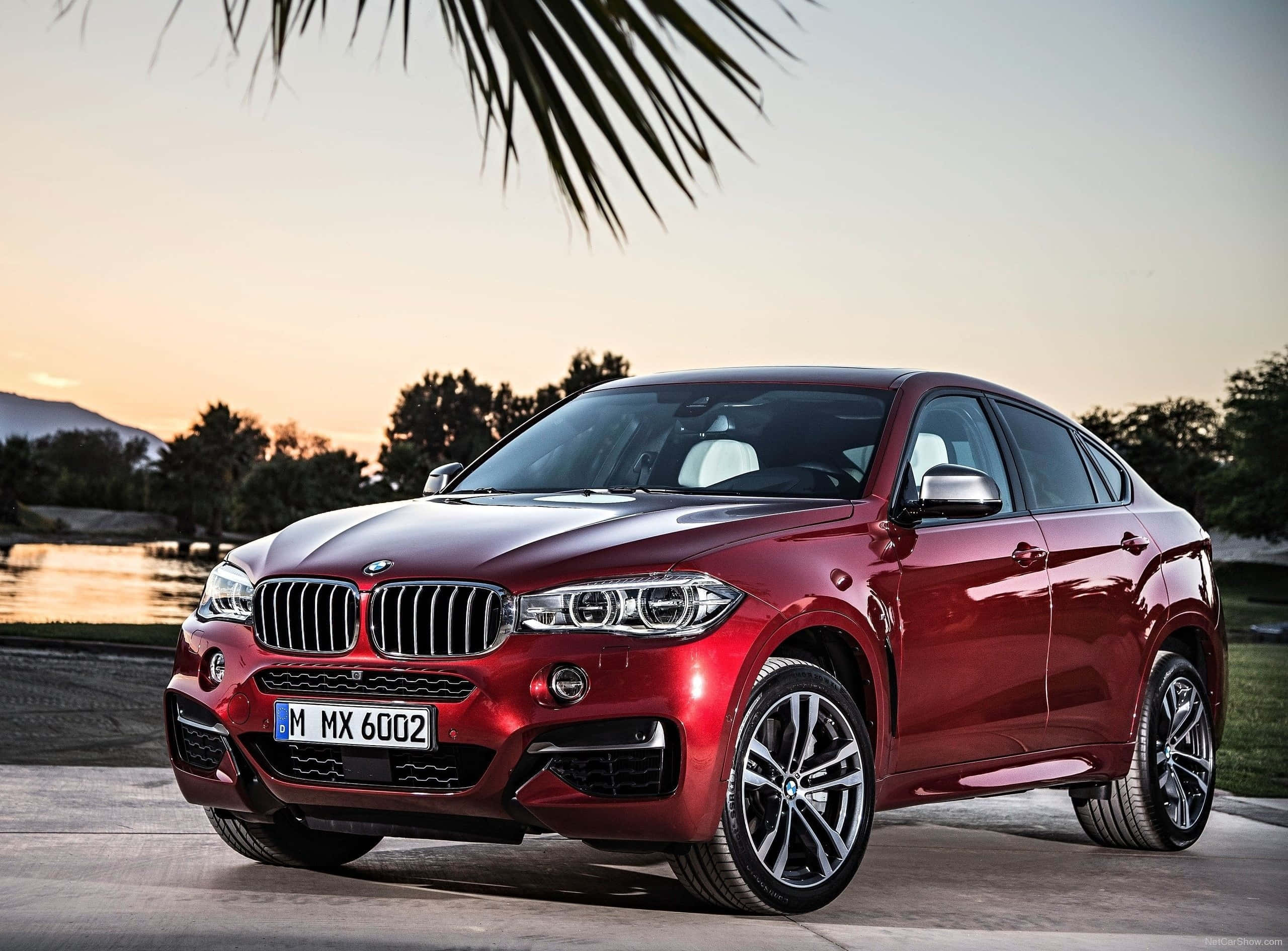 BMW X6 M, glossy red, paved surface, 2K Desktop Wallpaper