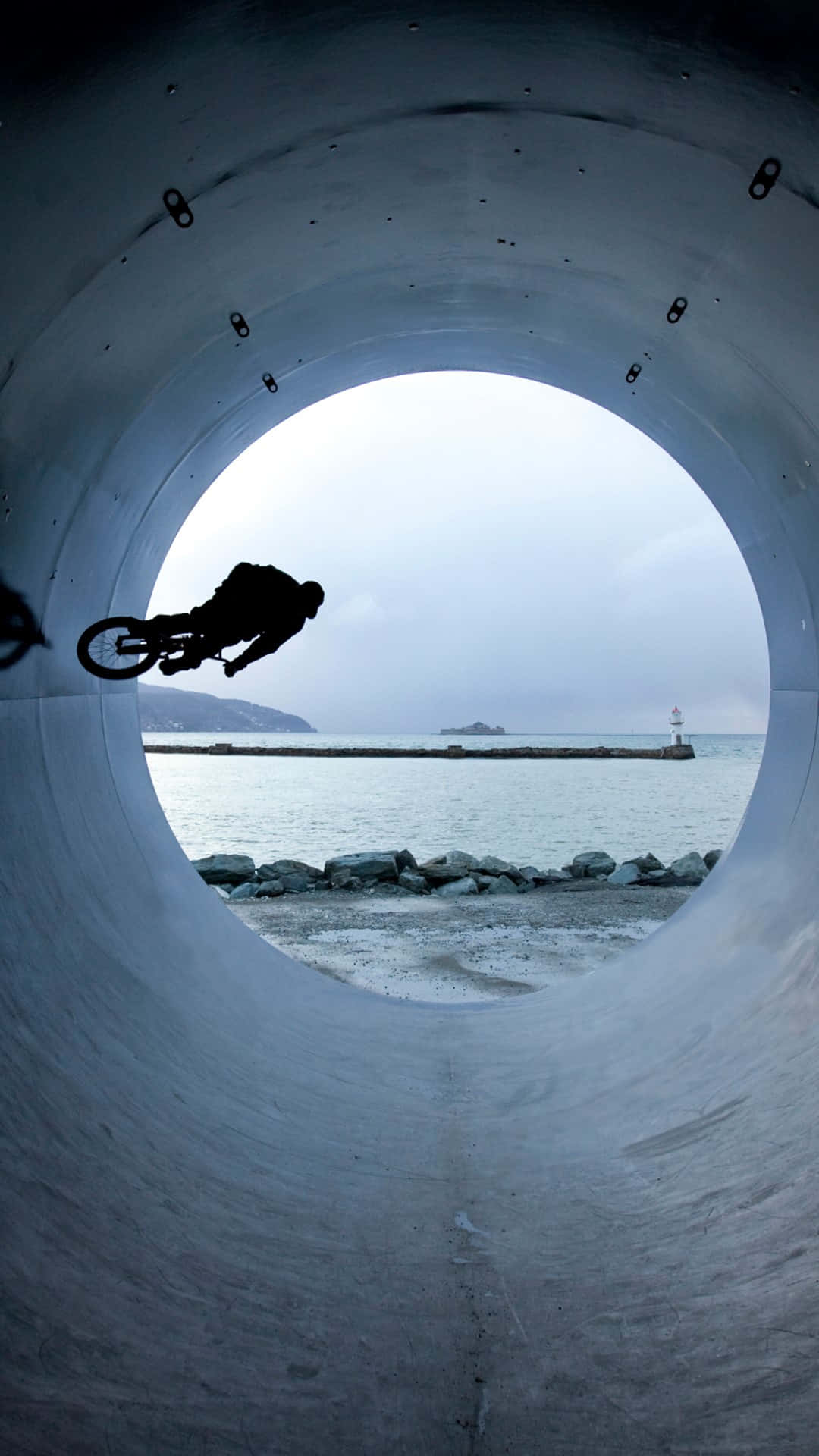 BMX, concrete tunnel, calm sea, Full HD Phone Wallpaper