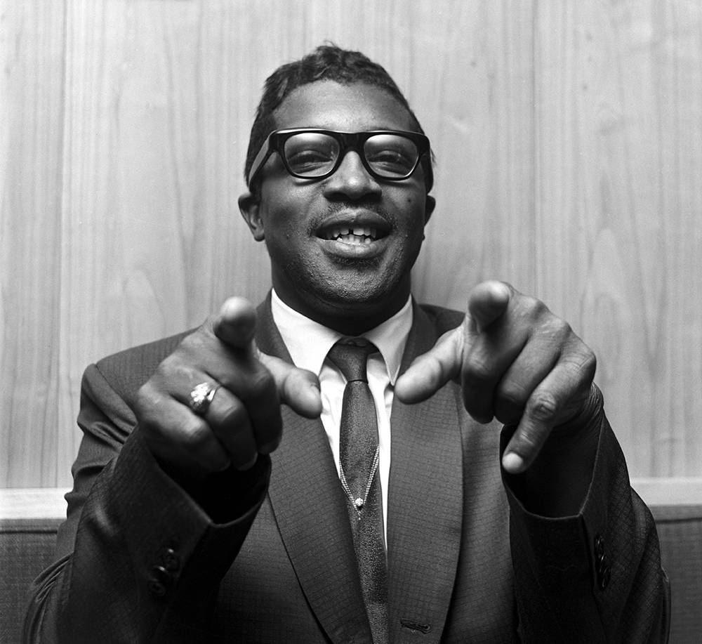 Bo Diddley, wood-paneled wall, black and white photo, SD Desktop Wallpaper