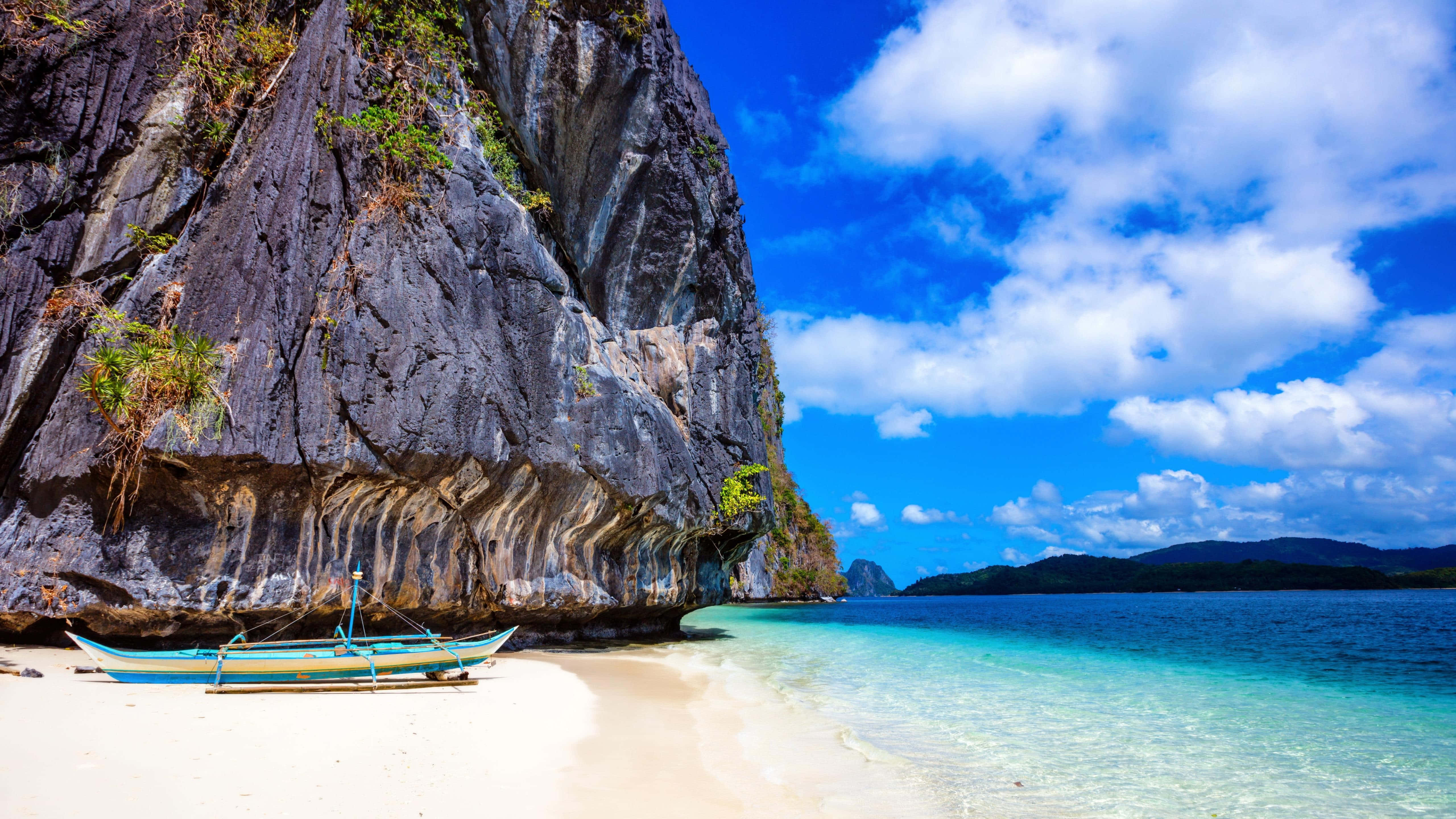 turquoise lagoon, white sand beach, towering gray cliffs, 5K Desktop Wallpaper