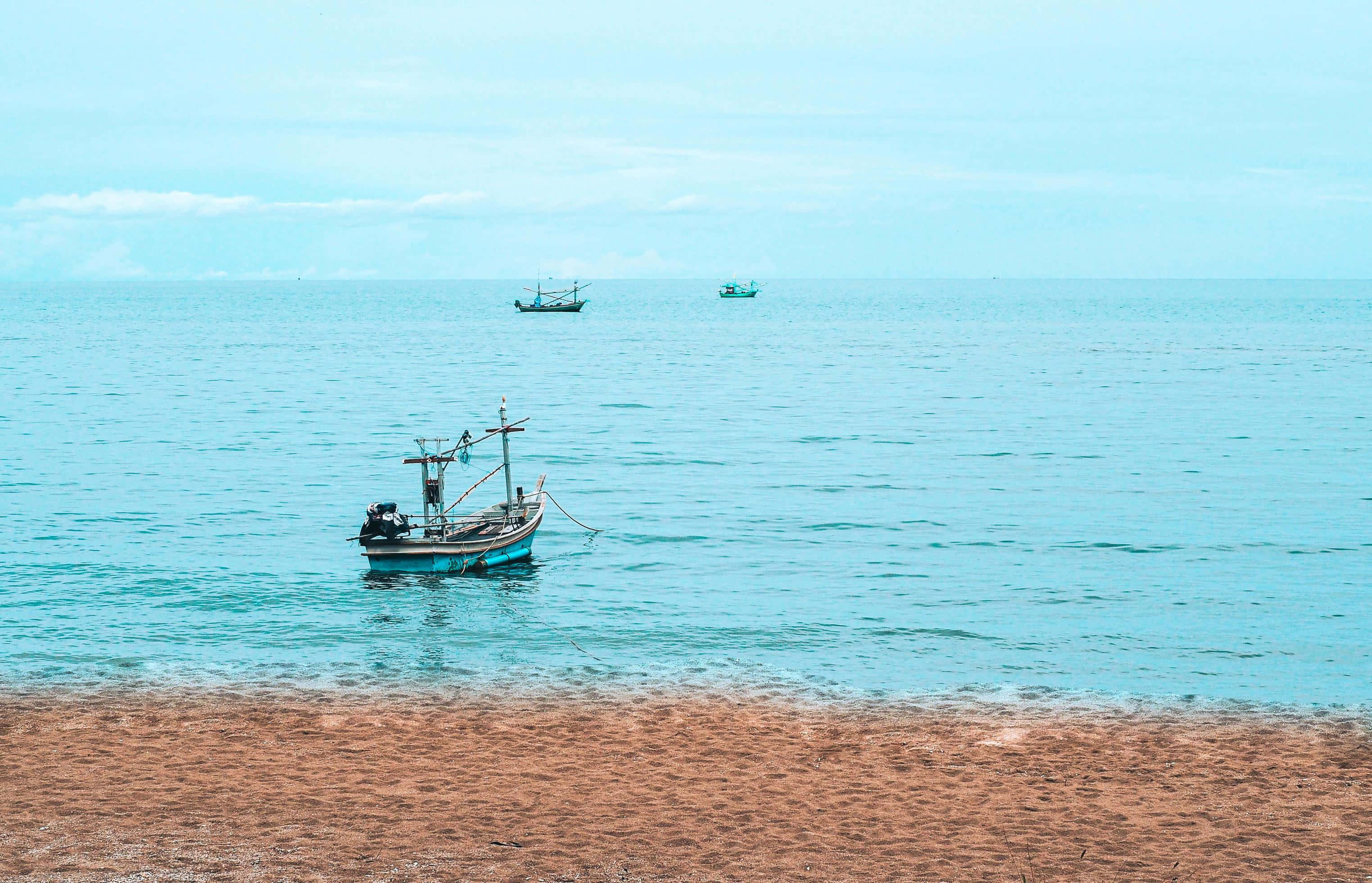 fishing boat, sandy shore, turquoise waters, 2K Desktop Wallpaper