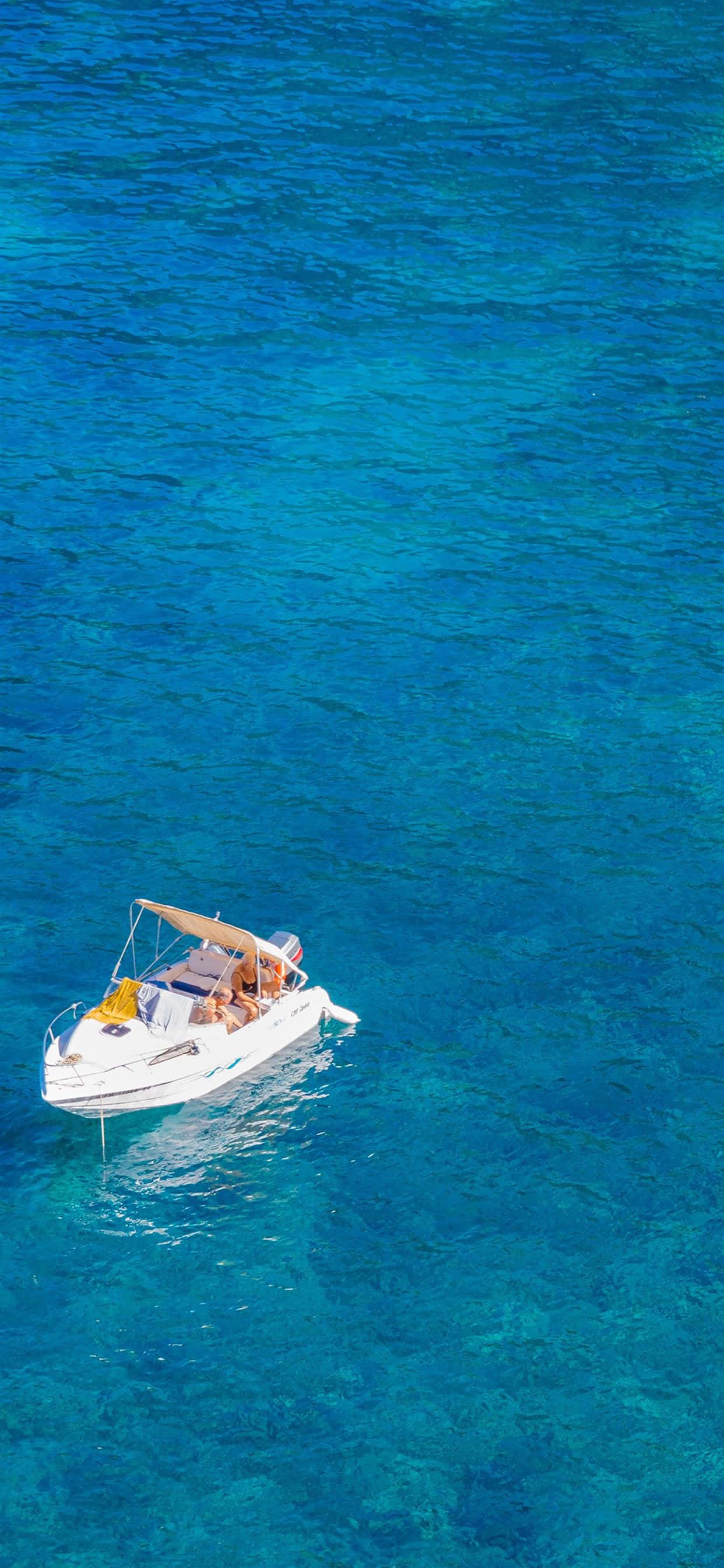 white motorboat, vibrant turquoise waters, bright daylight, 2K Phone Wallpaper